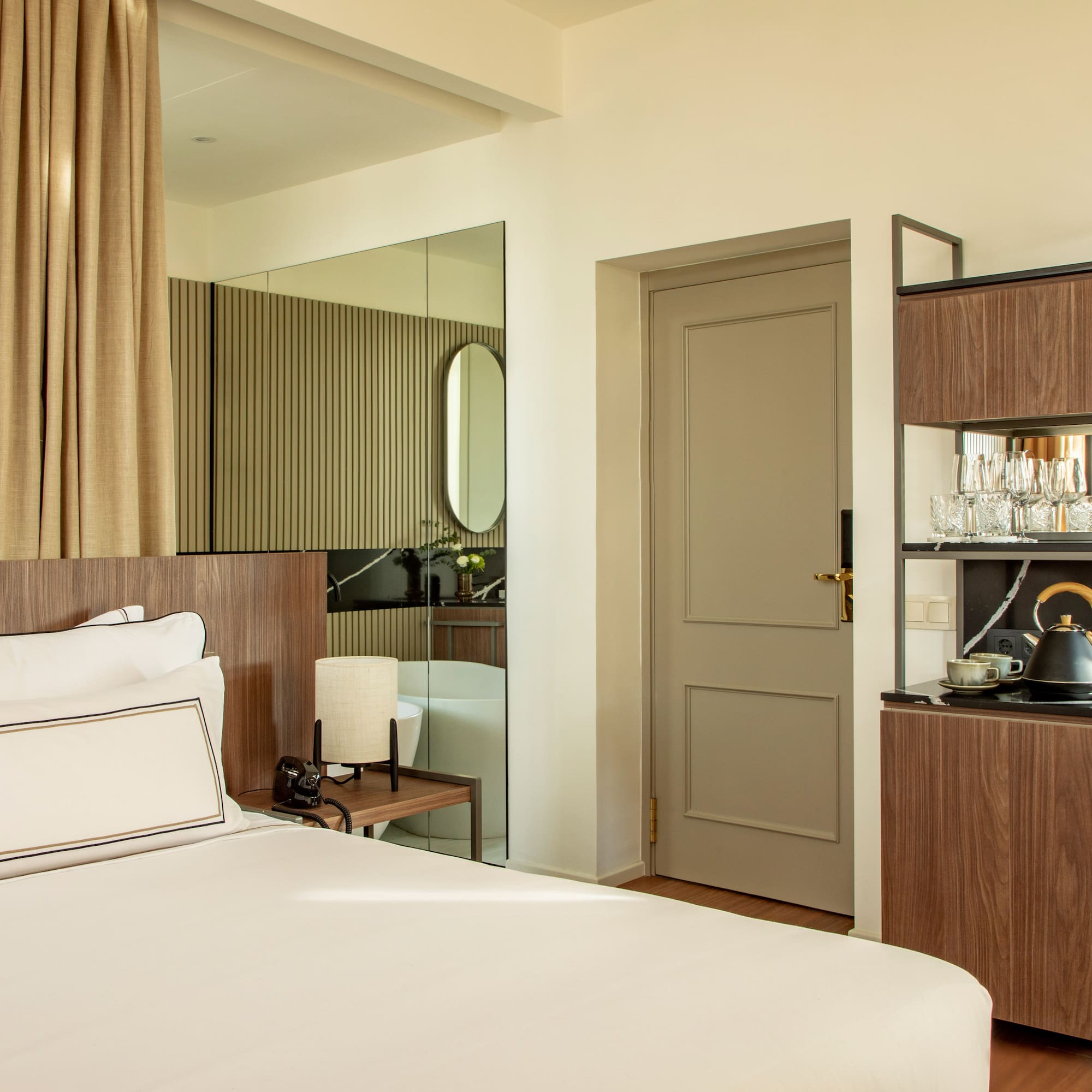 a room with a bed and a mirror