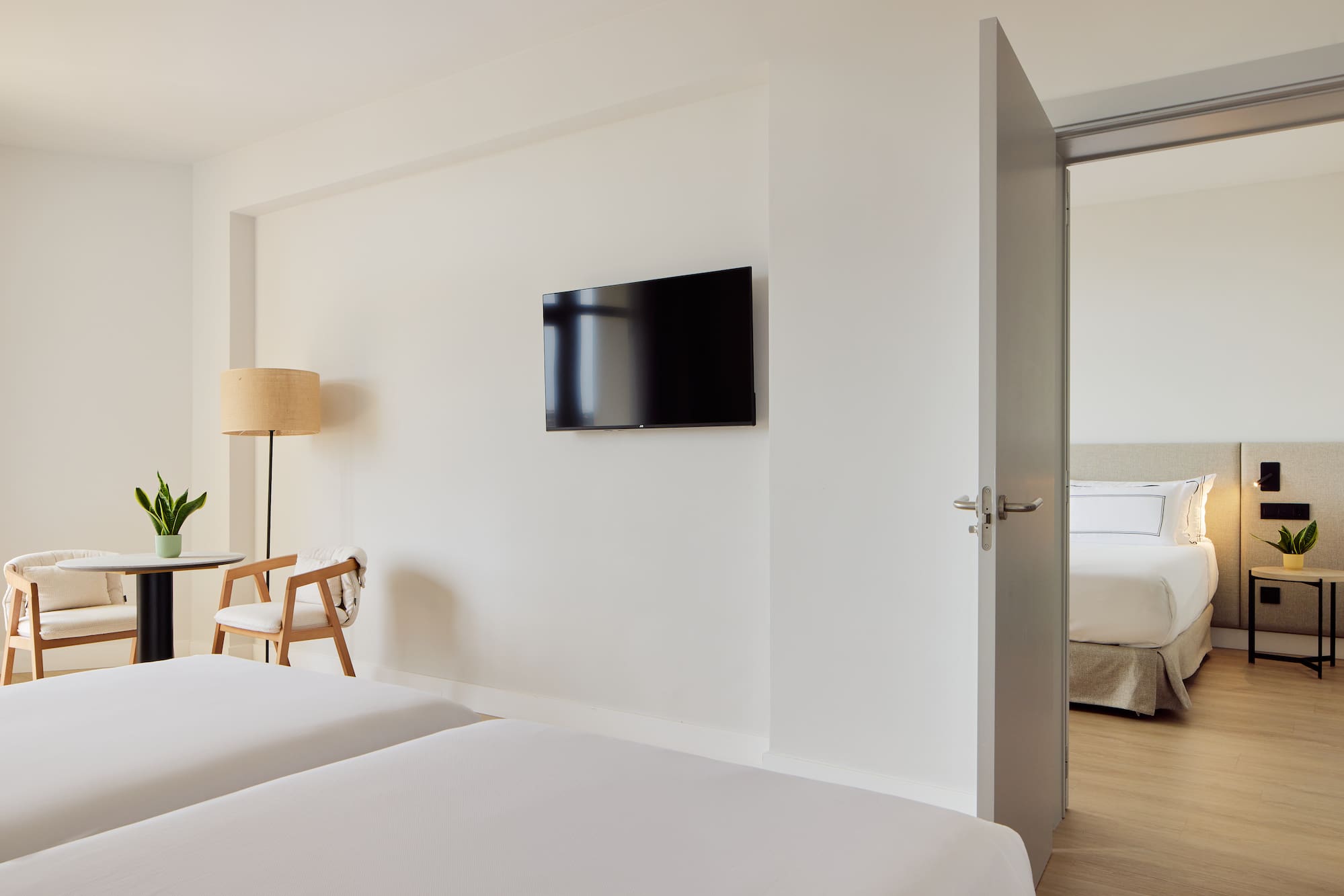 a room with a tv on the wall.