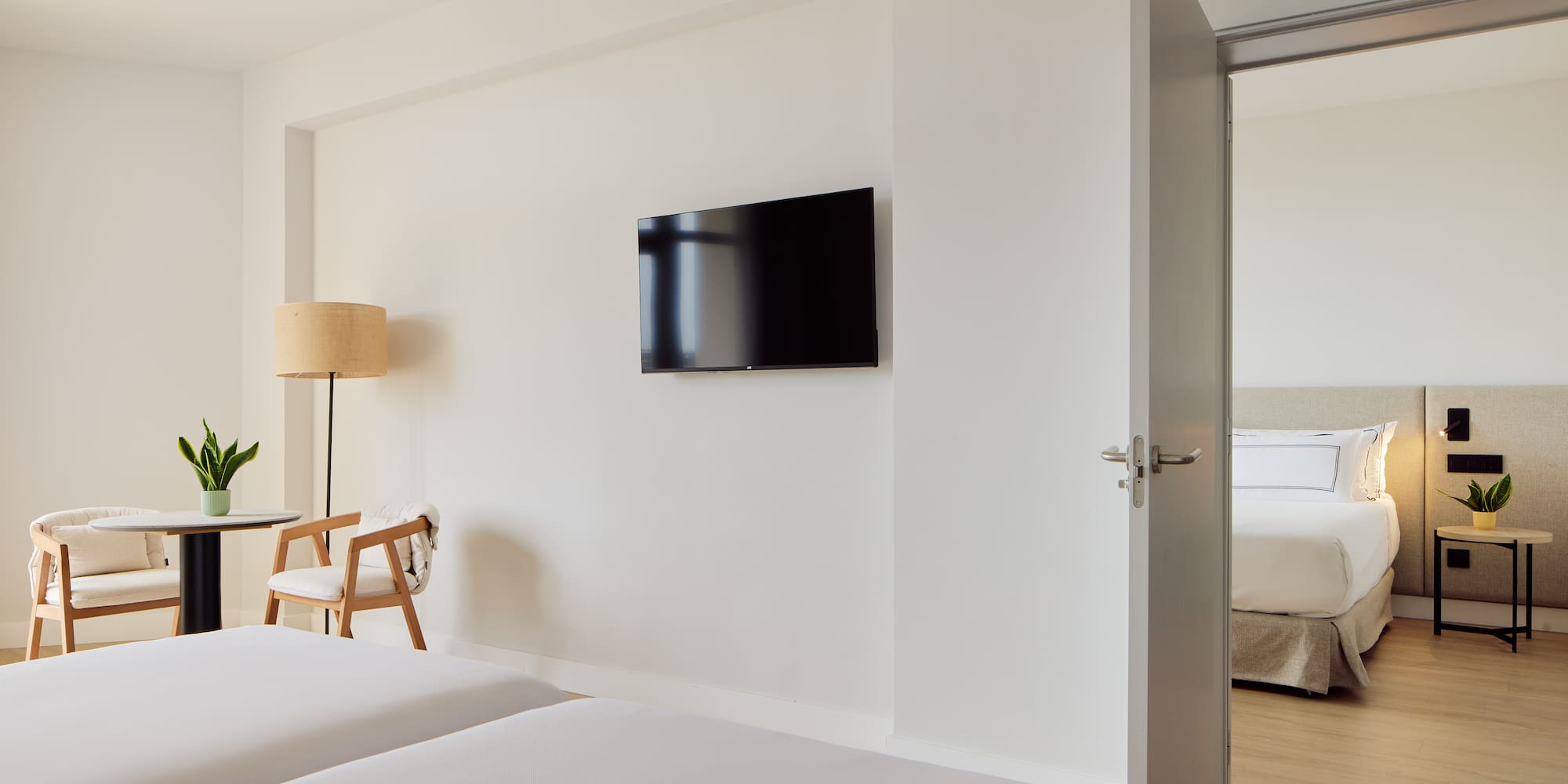 a room with a tv on the wall.