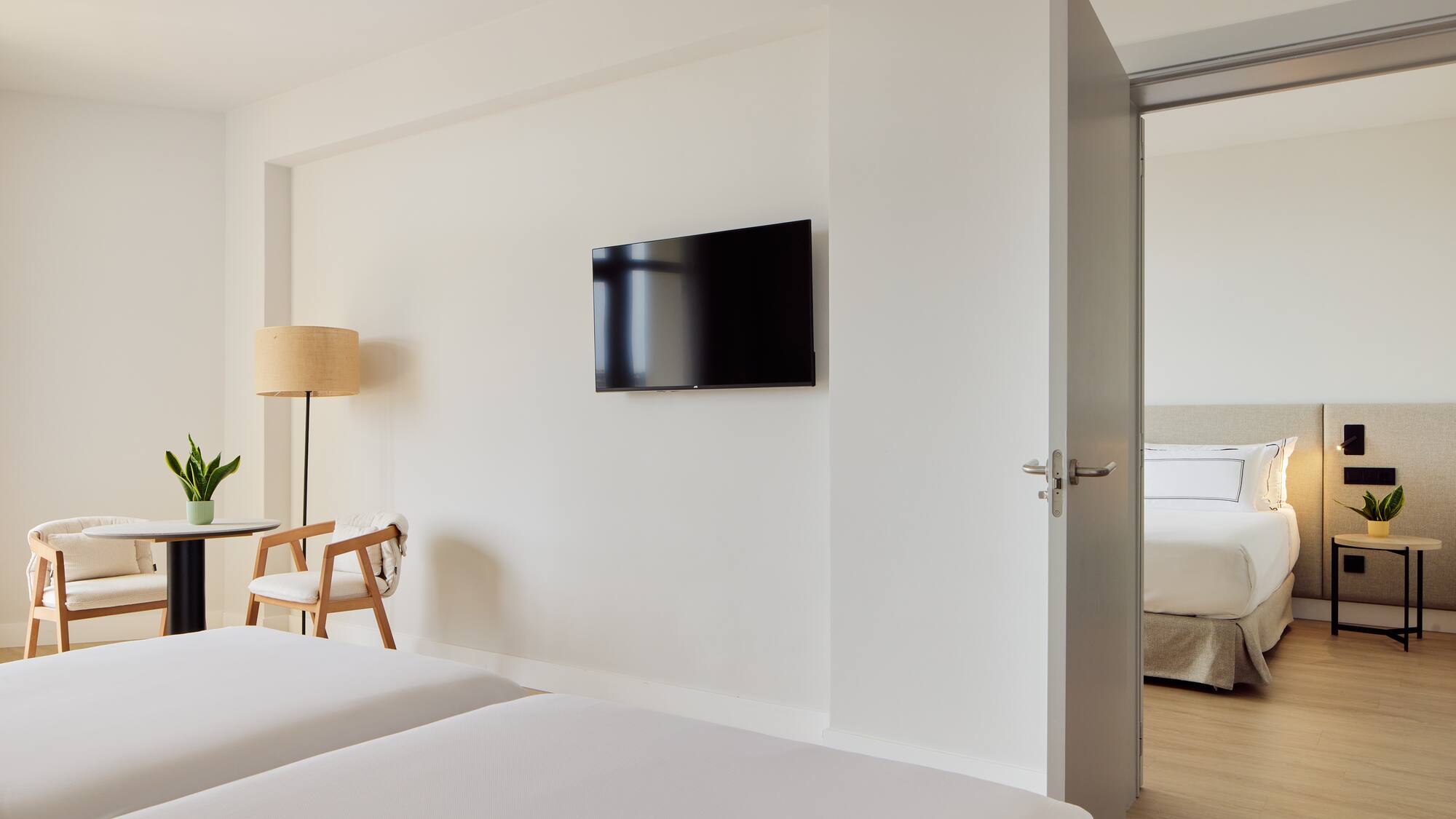 a room with a tv on the wall.