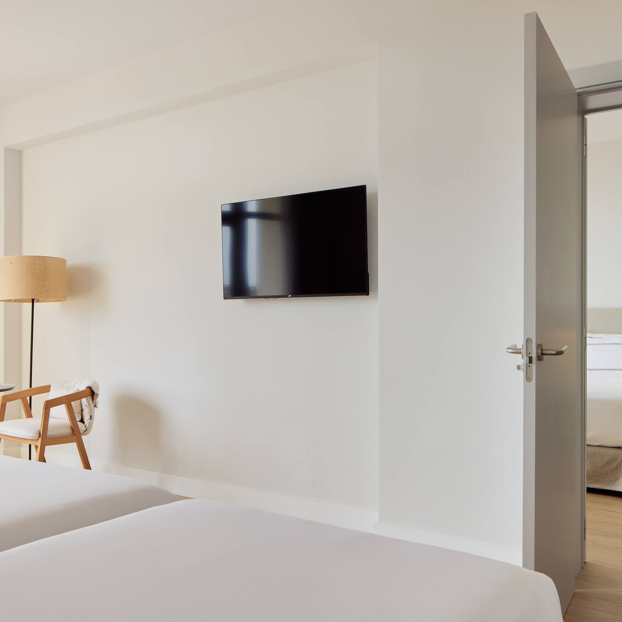 a room with a tv on the wall.