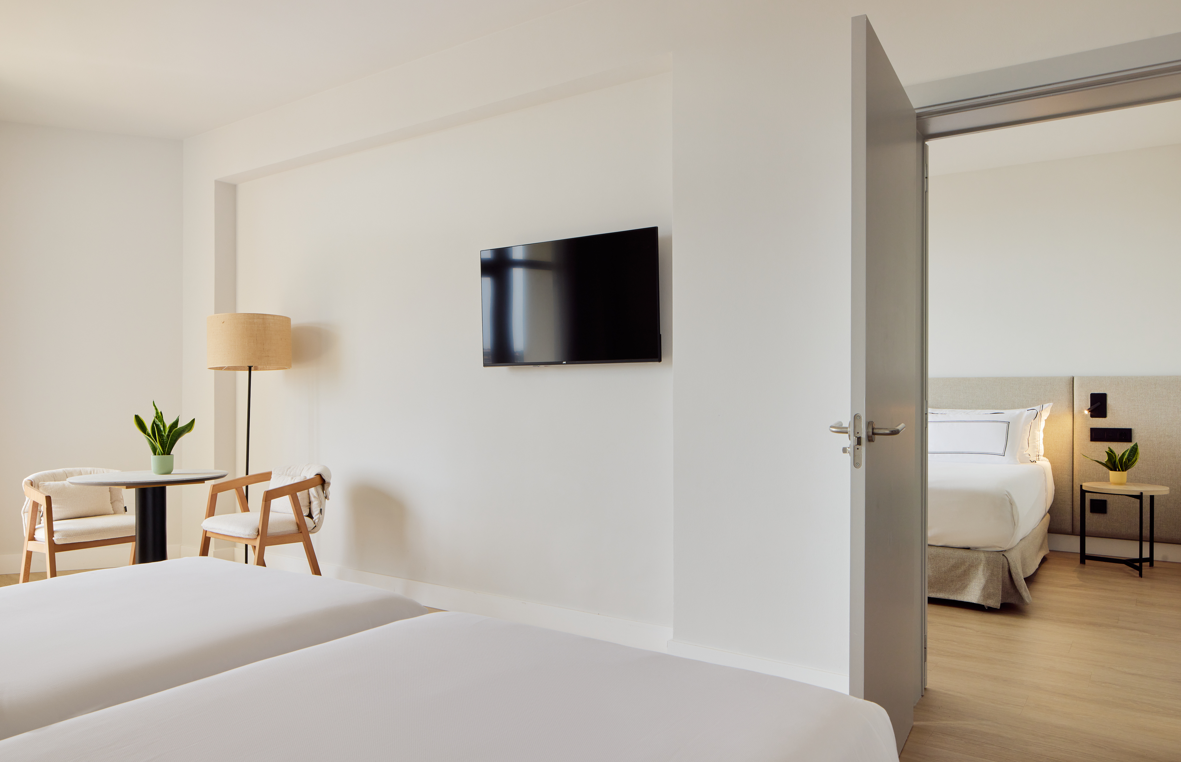 a room with a tv on the wall.