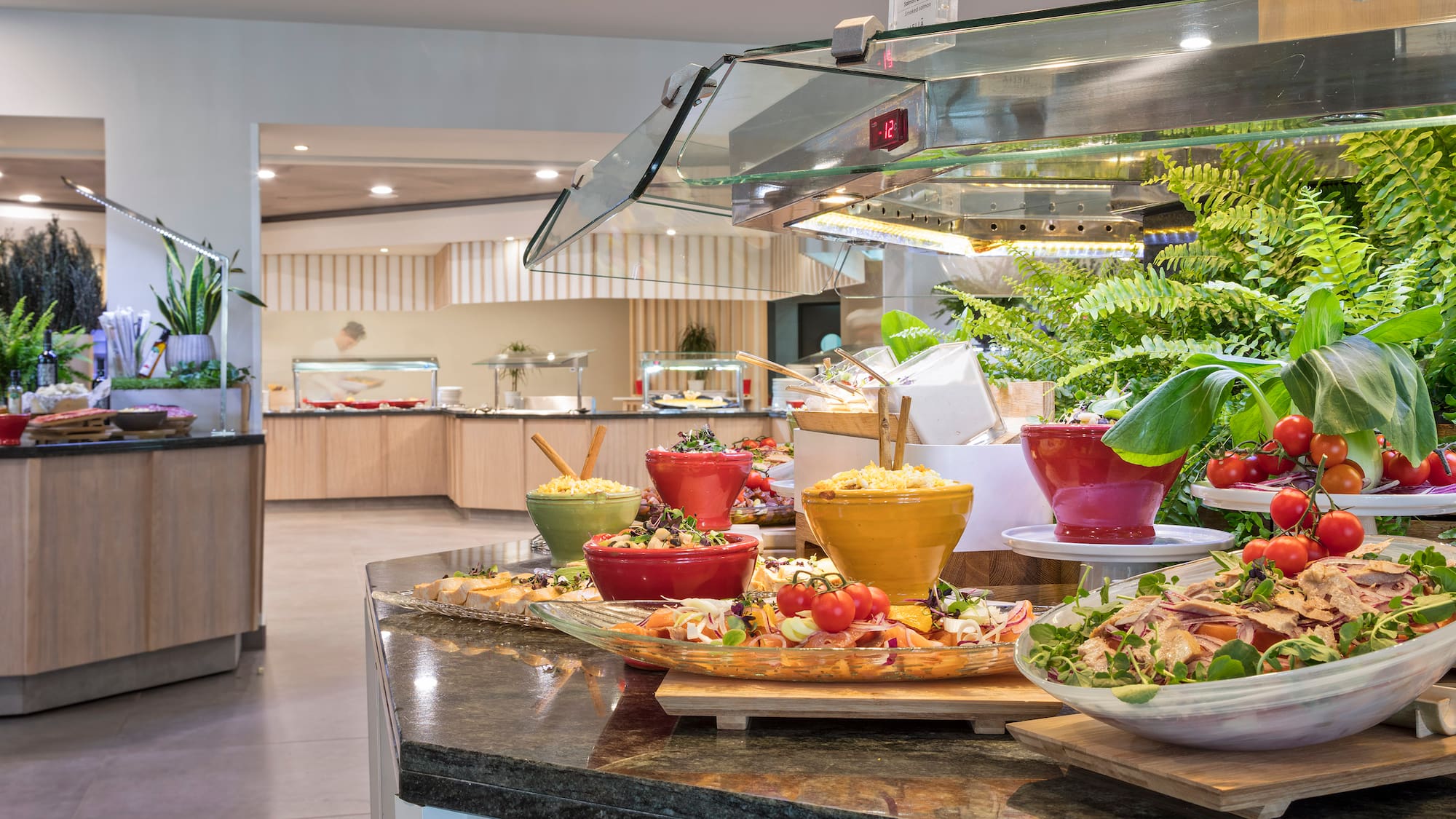 a buffet table with food in bowls