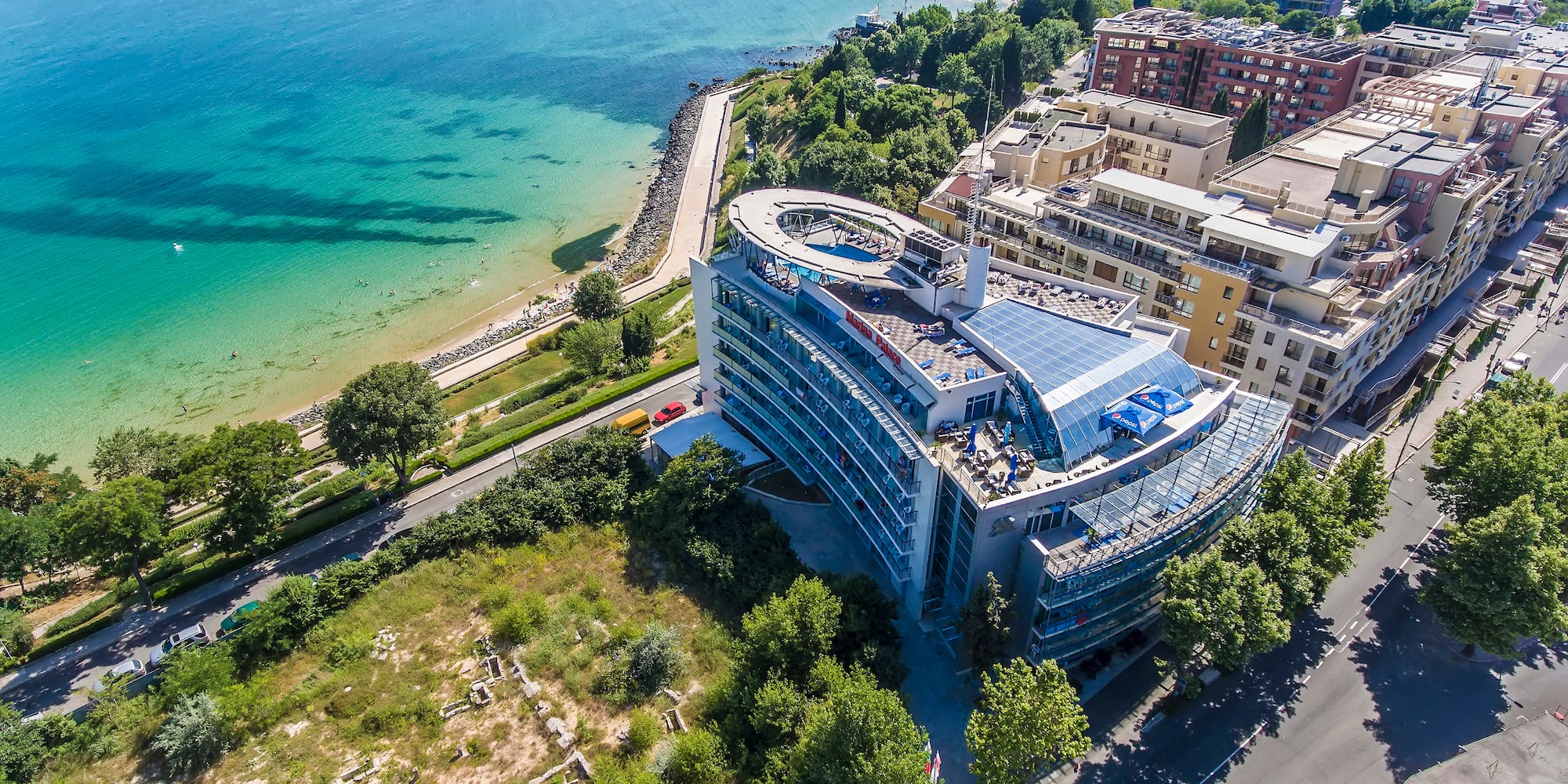 a building next to a body of water