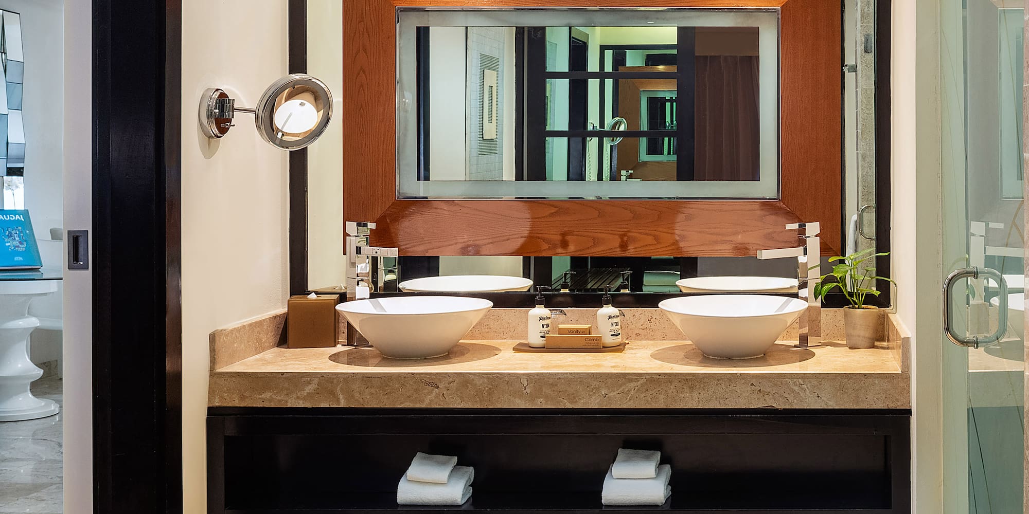 a bathroom with a mirror and sinks