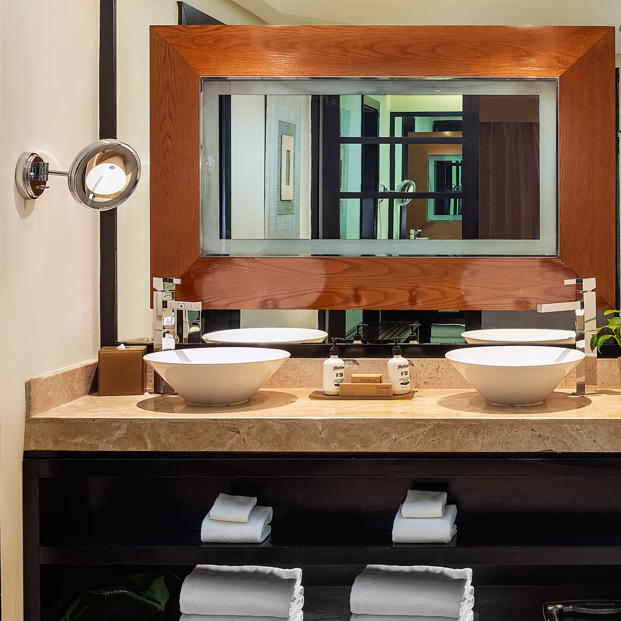 a bathroom with a mirror and sinks