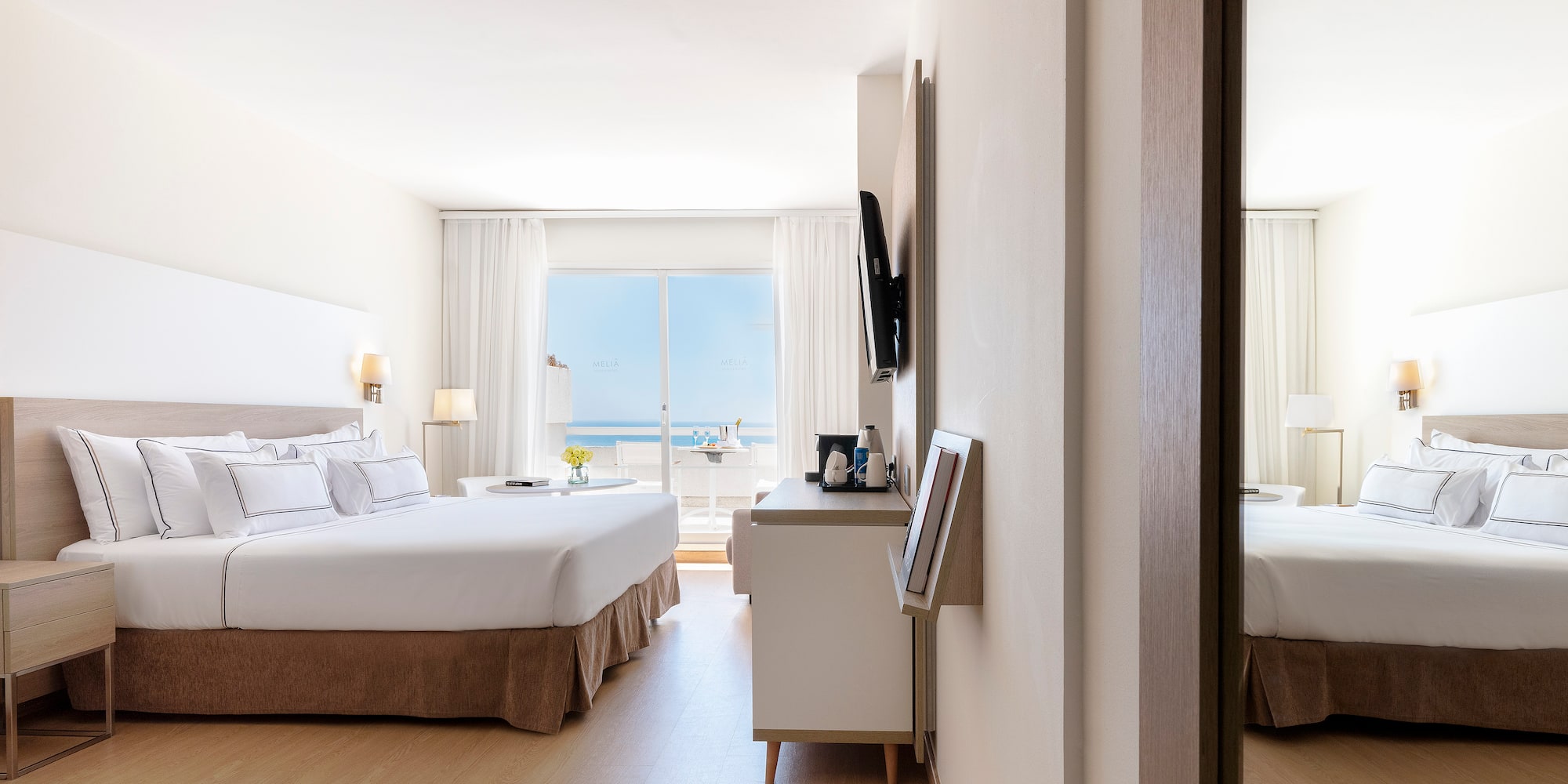 a room with a bed and a mirror