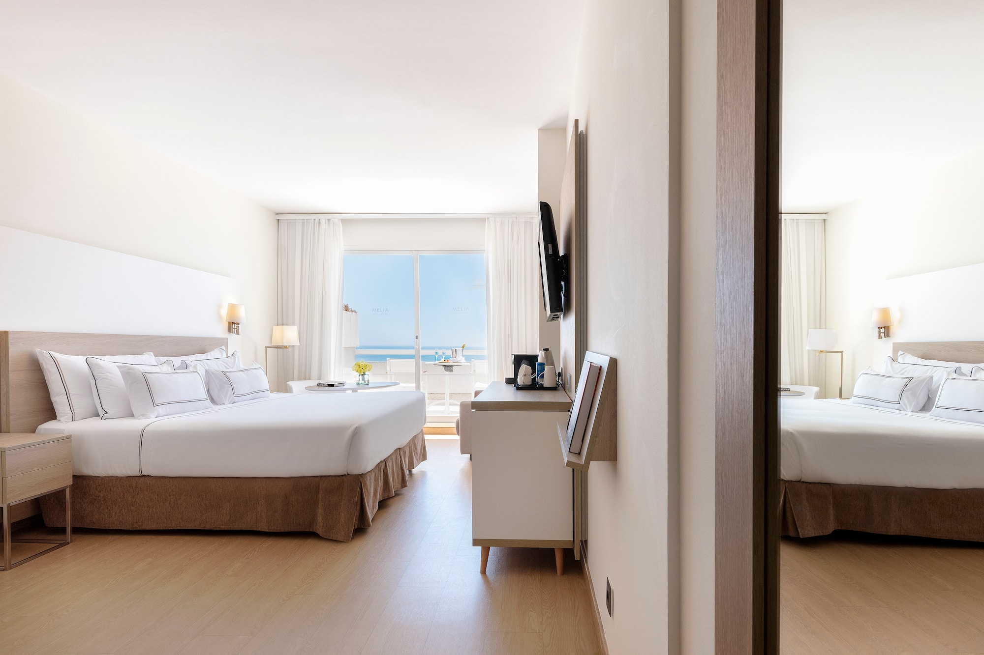 a room with a bed and a mirror