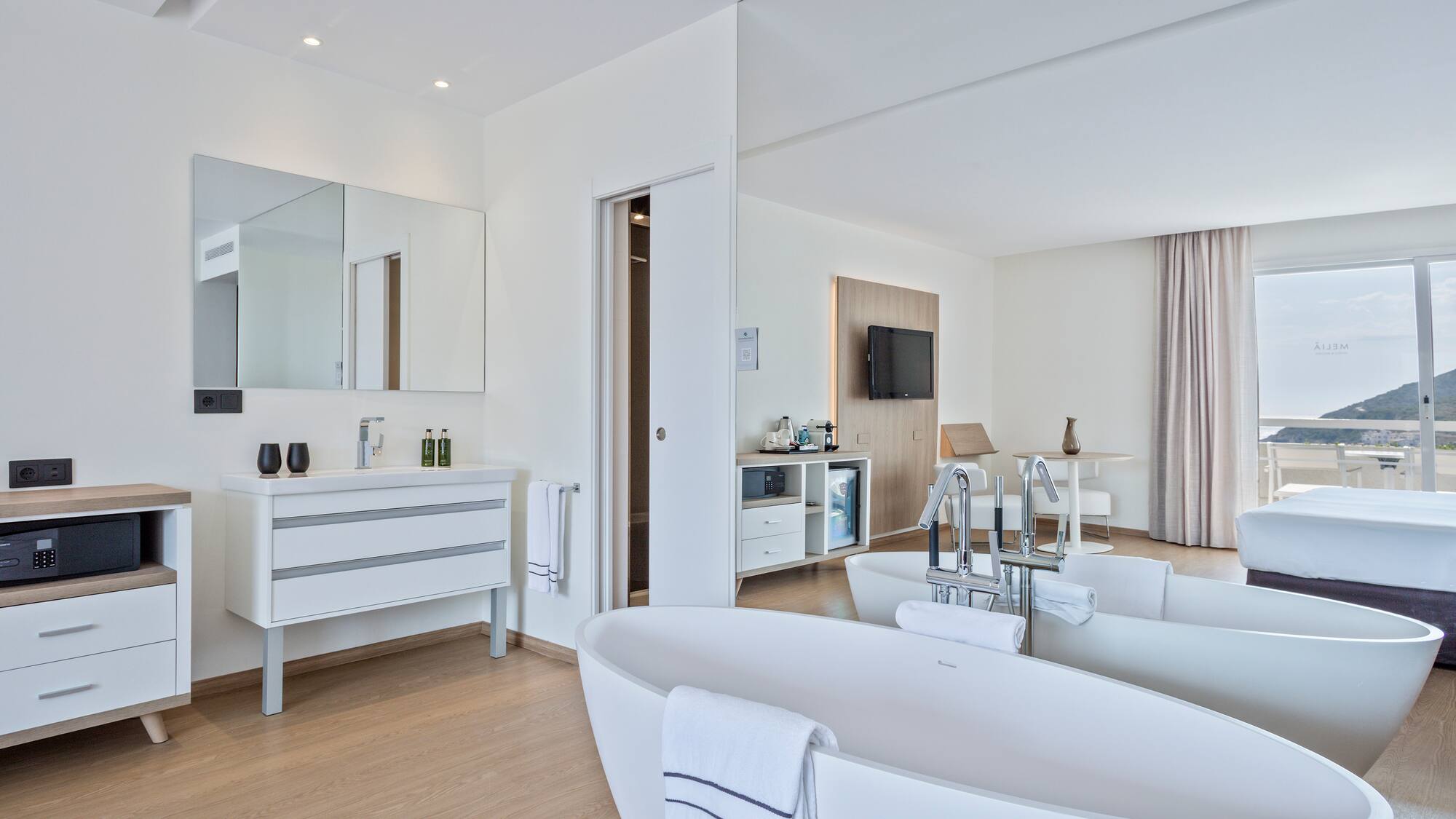 a bathroom with a large tub and a mirror