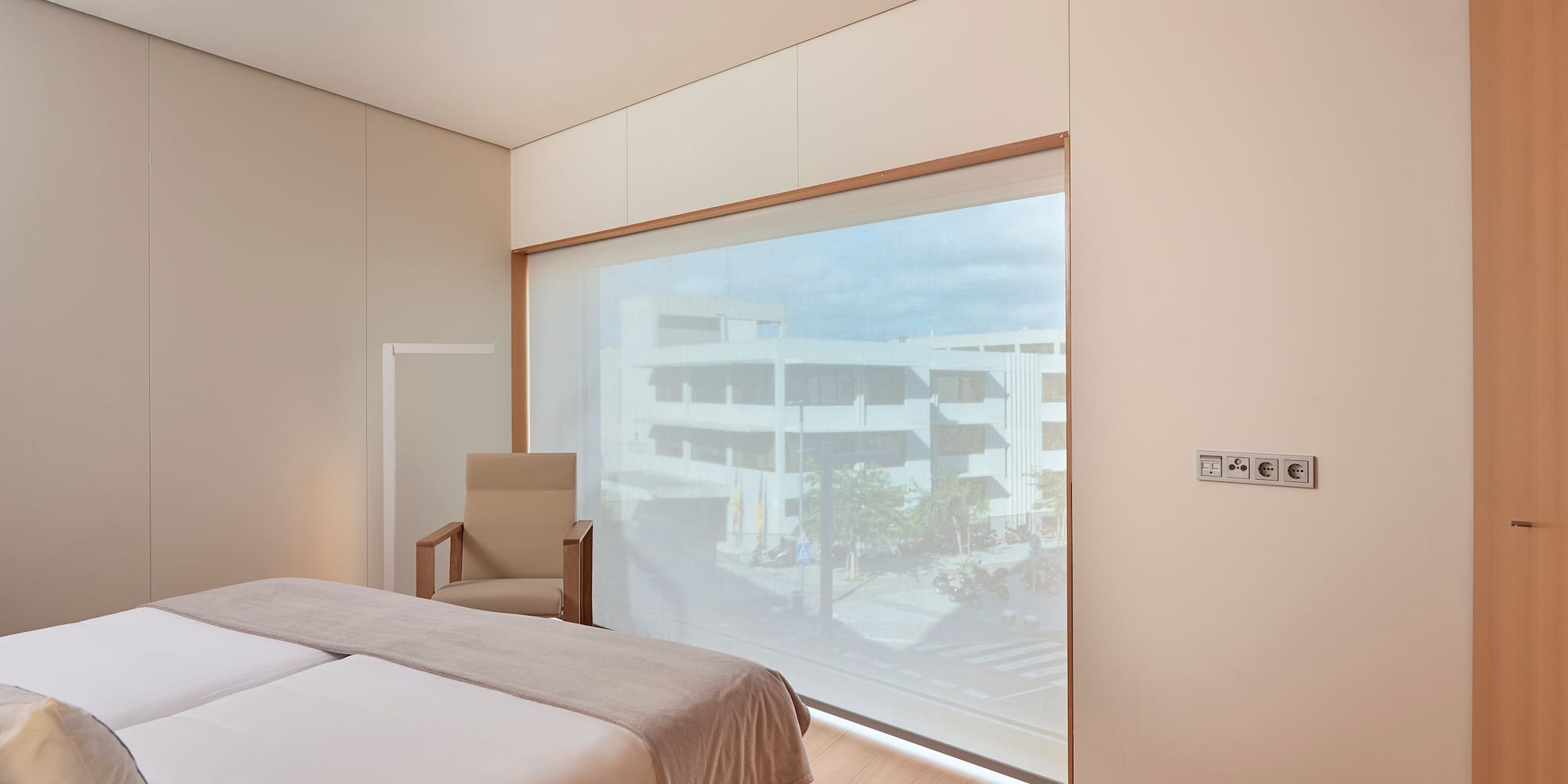 a bedroom with a large window