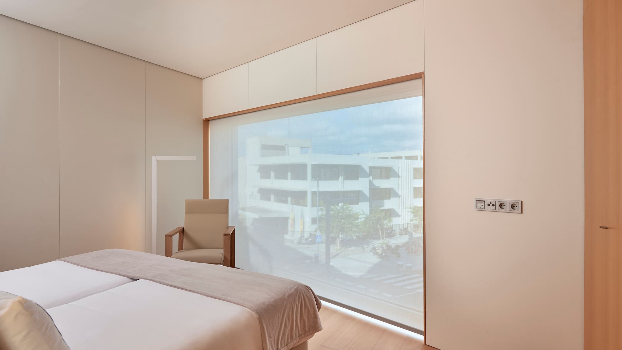 a bedroom with a large window