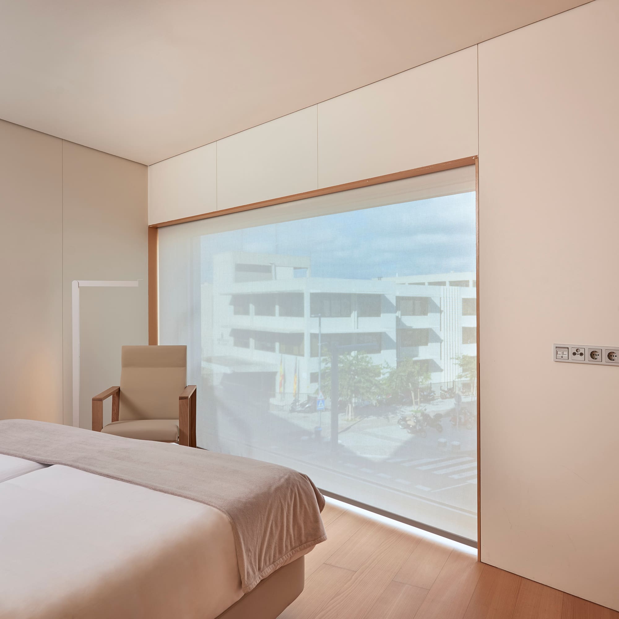 a bedroom with a large window