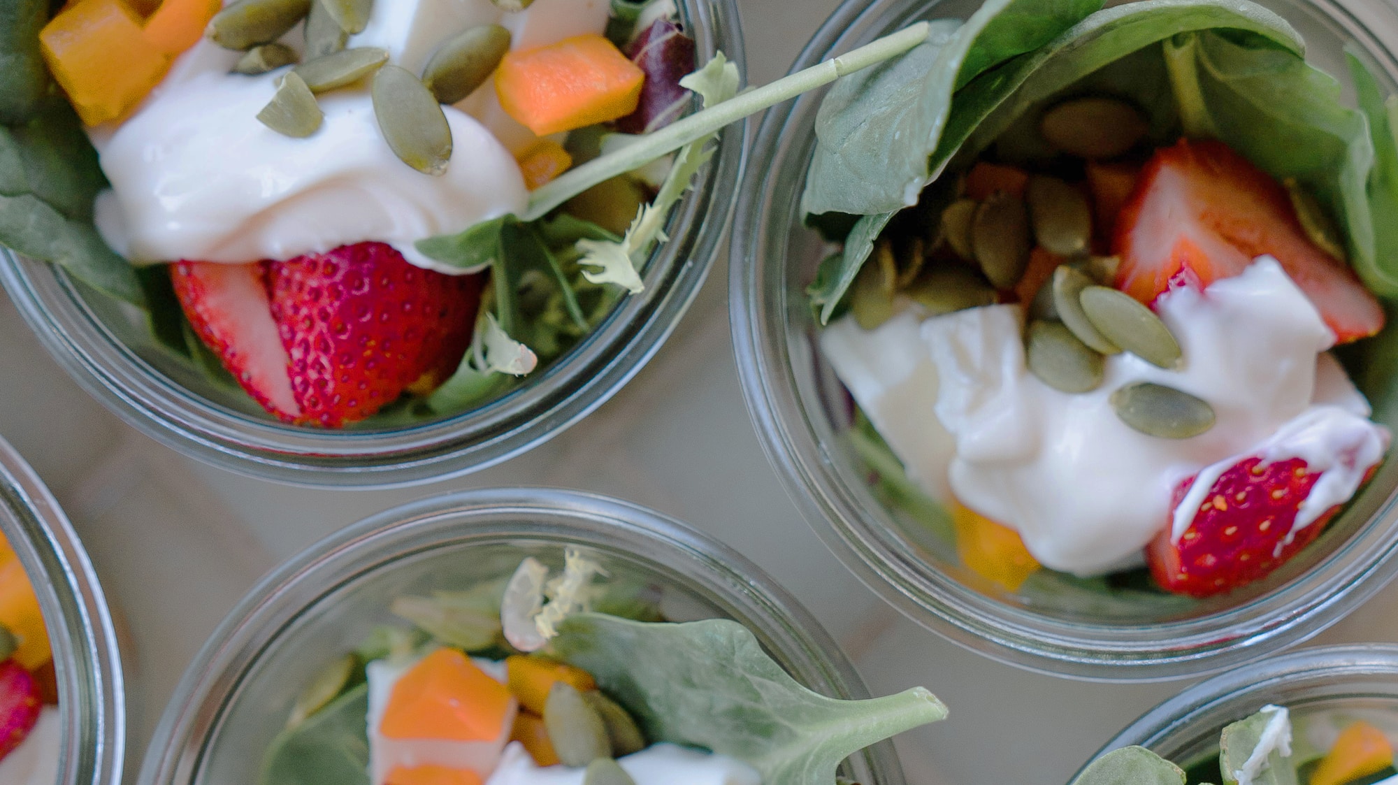 a group of small cups of food