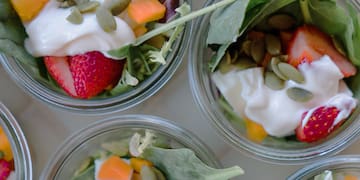 a group of small cups of food