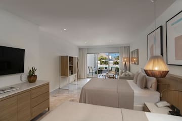 a bedroom with a bed and a table