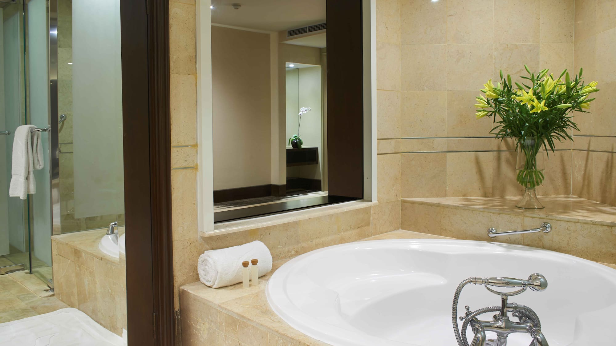 a bathroom with a large tub and a mirror