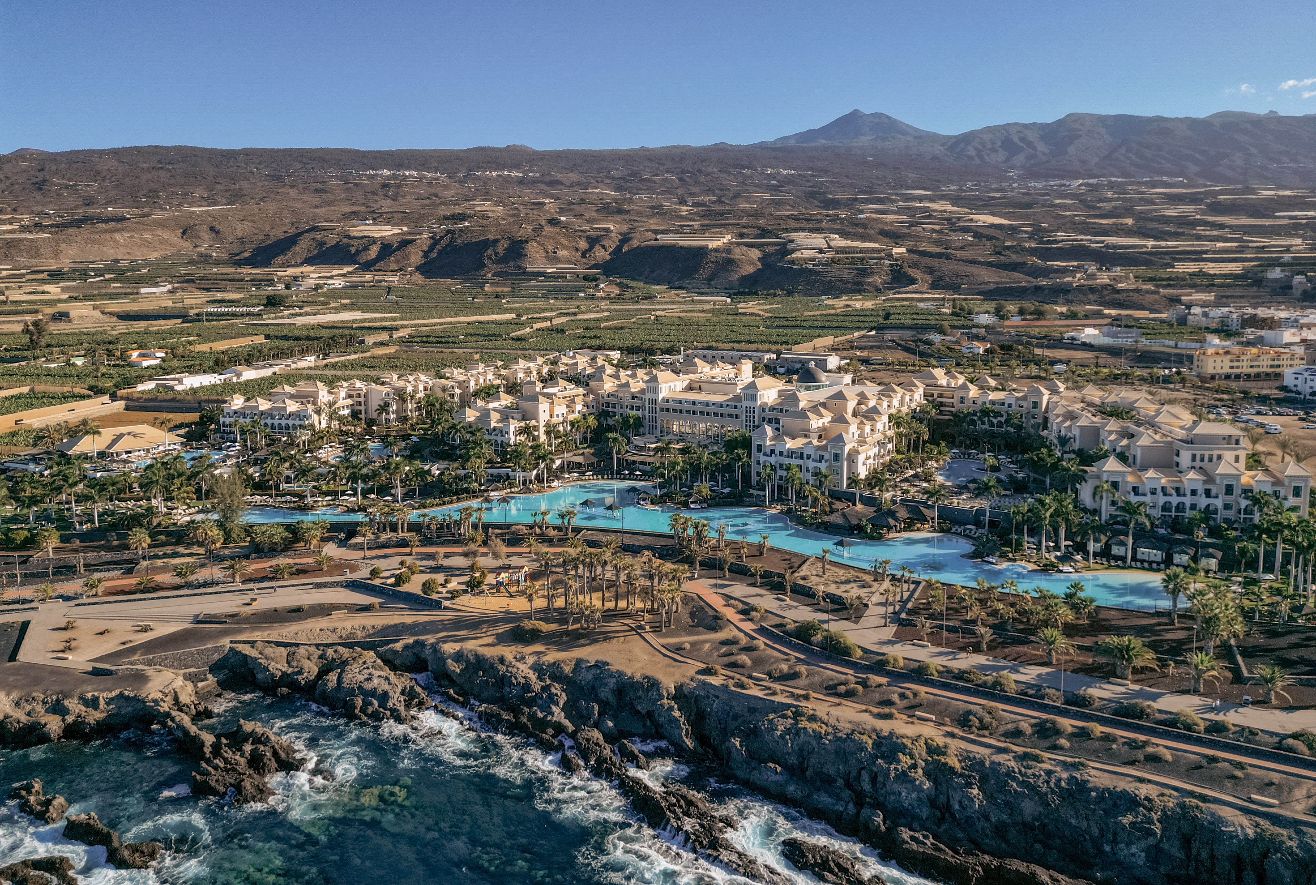 a resort with a pool and water