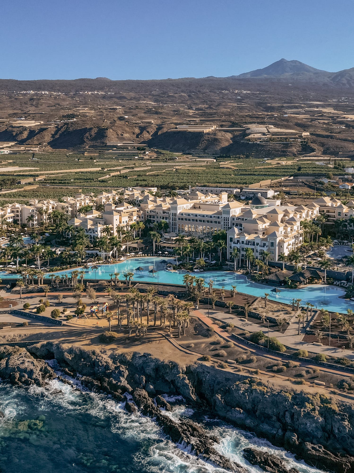 a resort with a pool and water