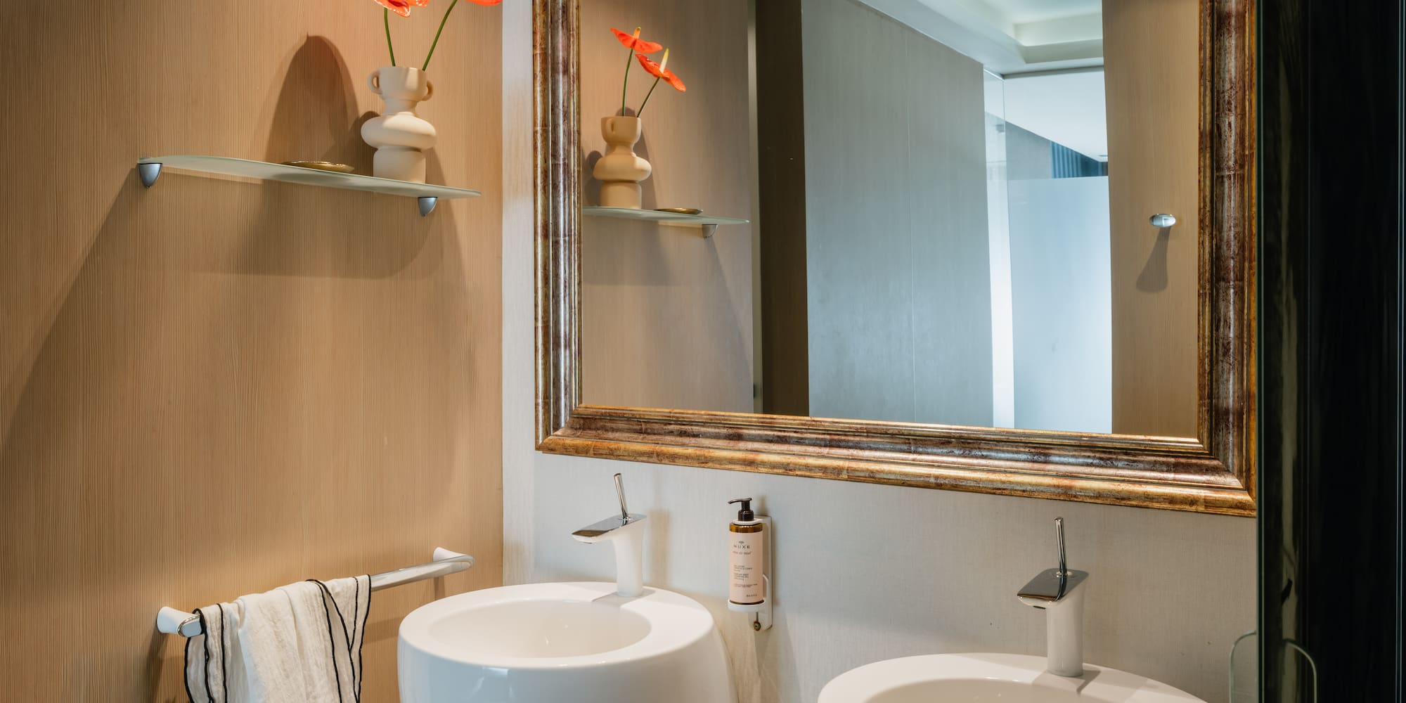 a mirror above a sink