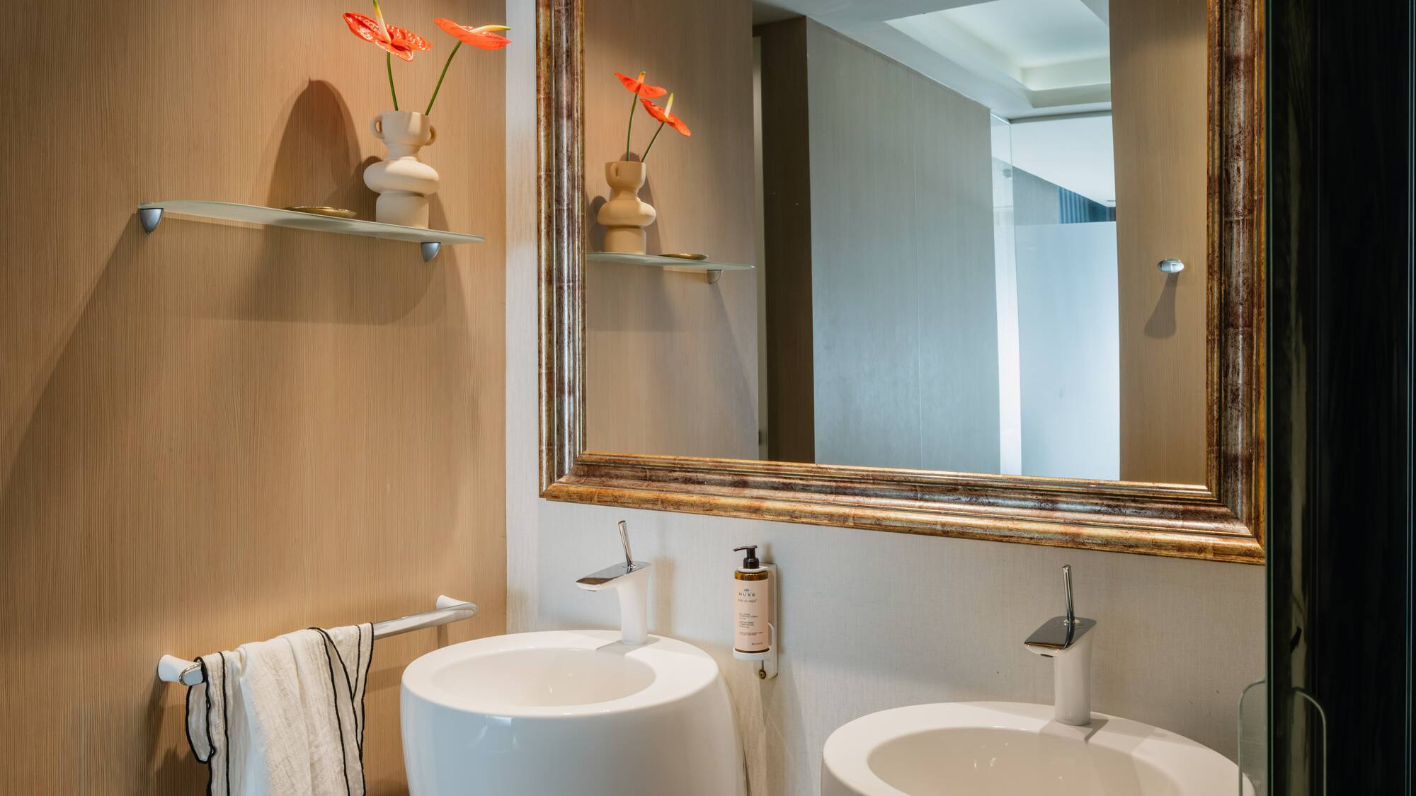 a mirror above a sink