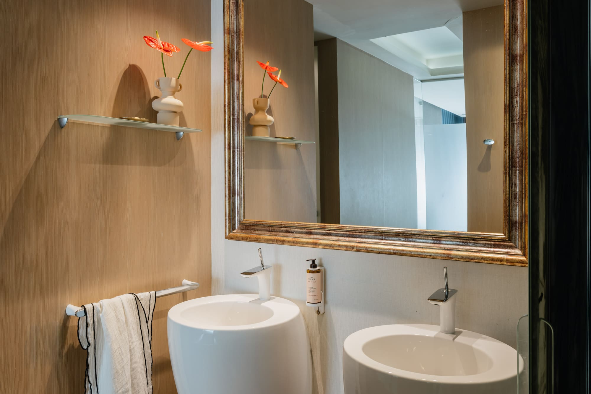 a mirror above a sink