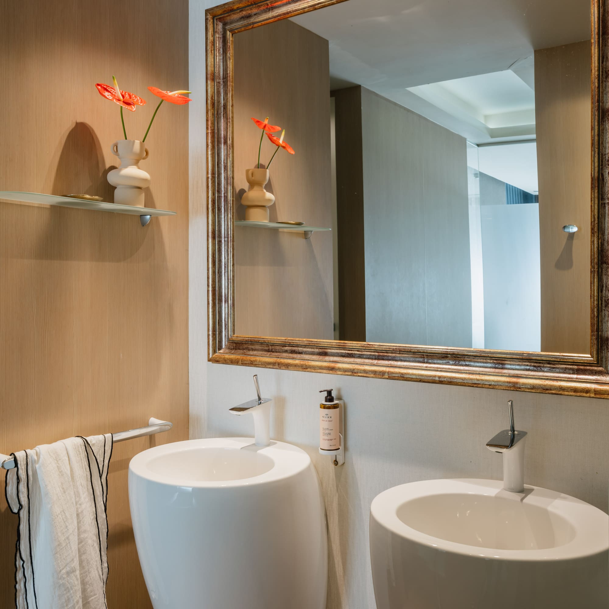 a mirror above a sink