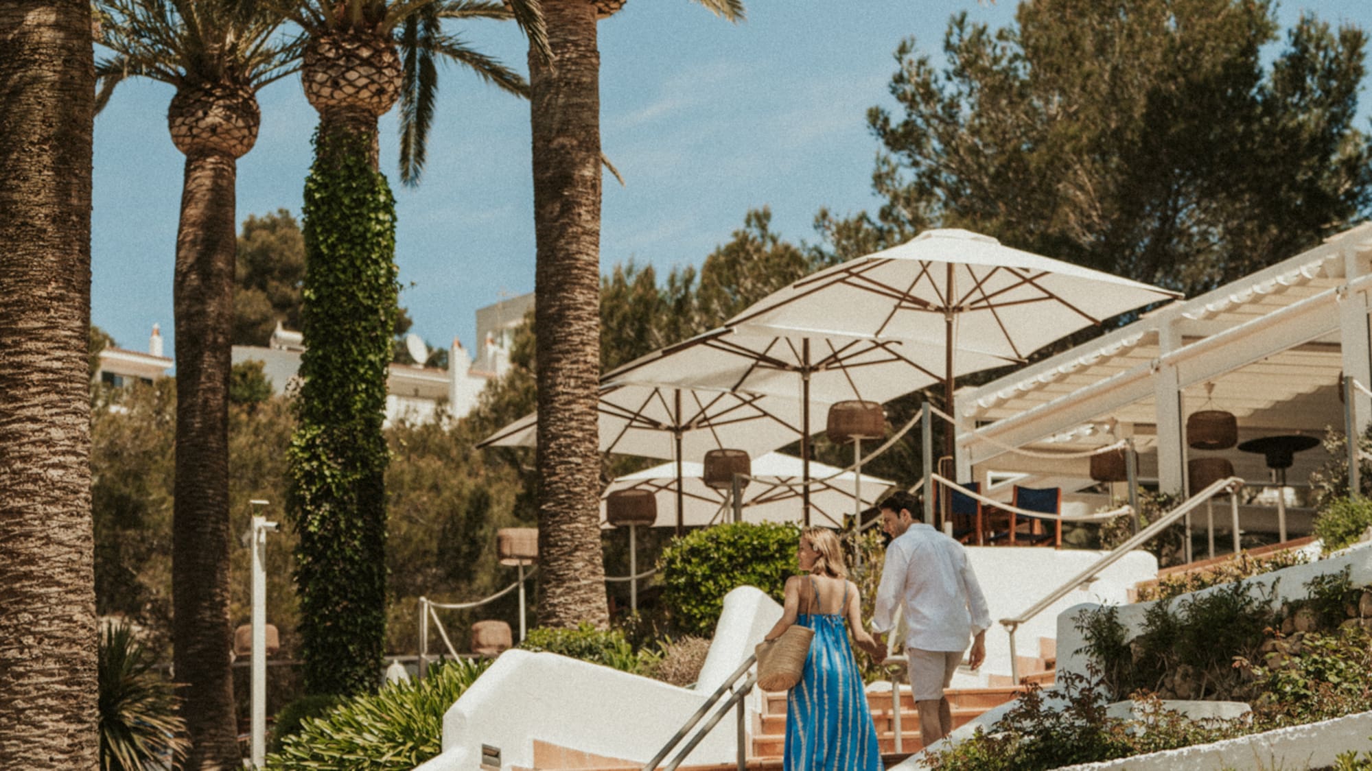 a man and woman walking up stairs