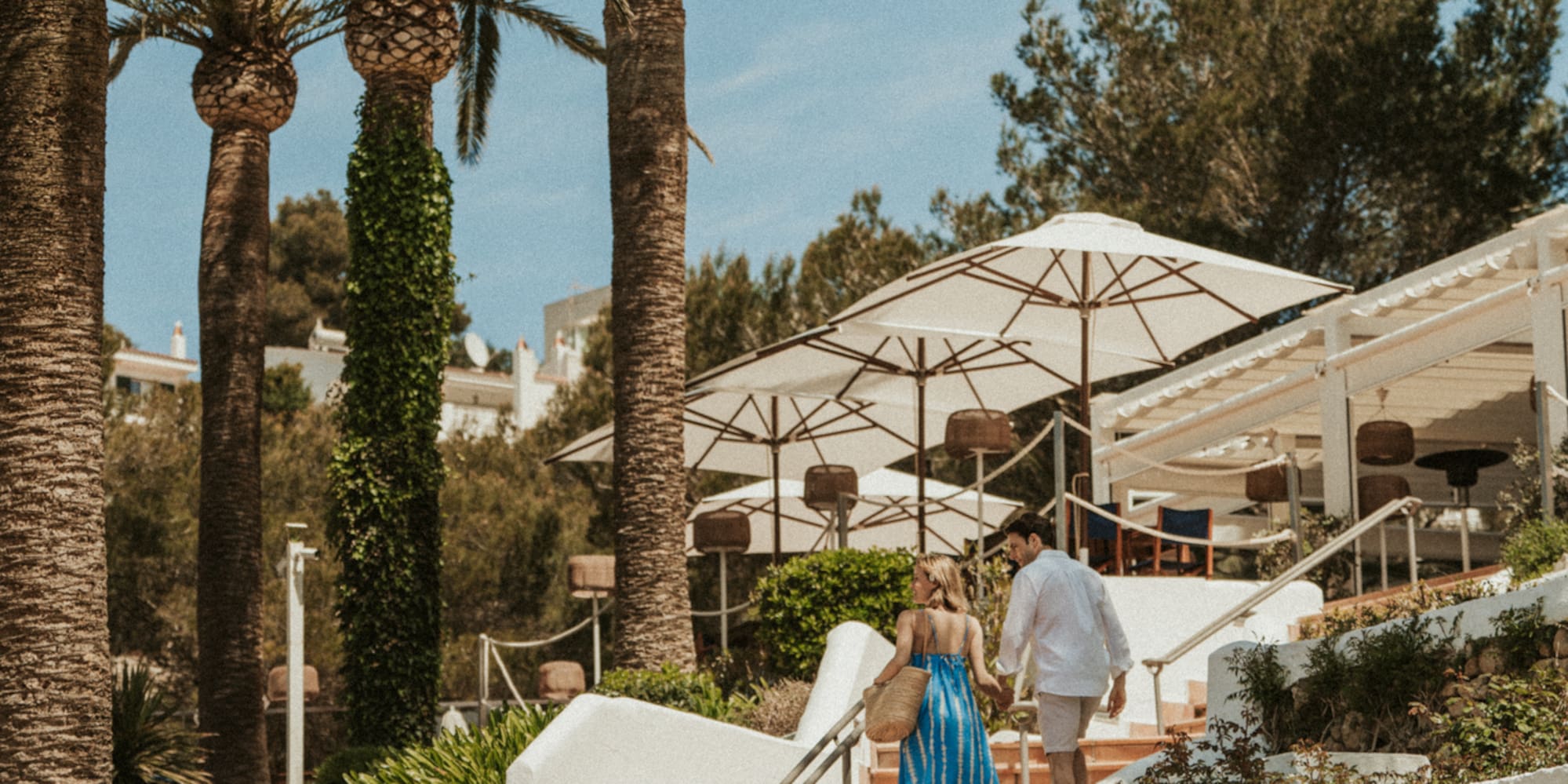 a man and woman walking up stairs
