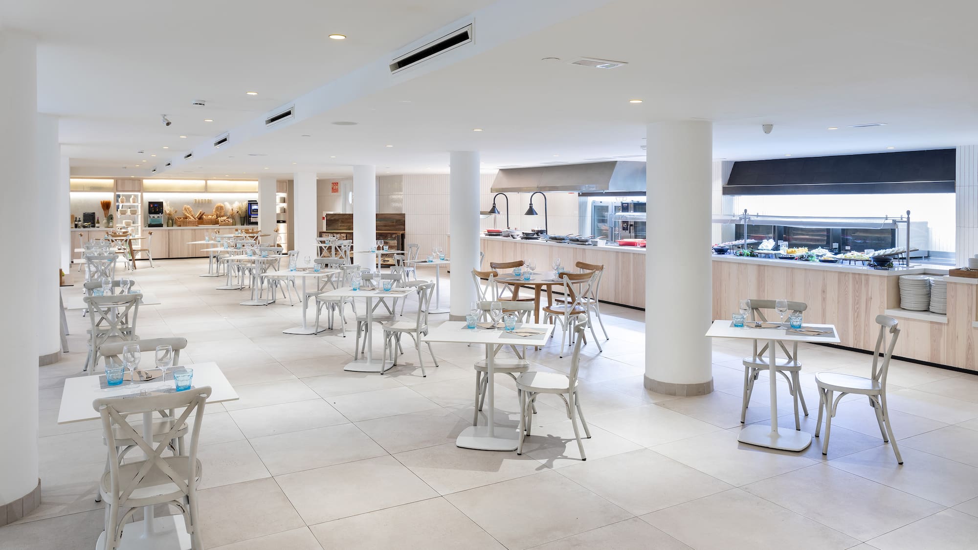 a large room with tables and chairs