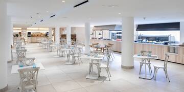 a large room with tables and chairs