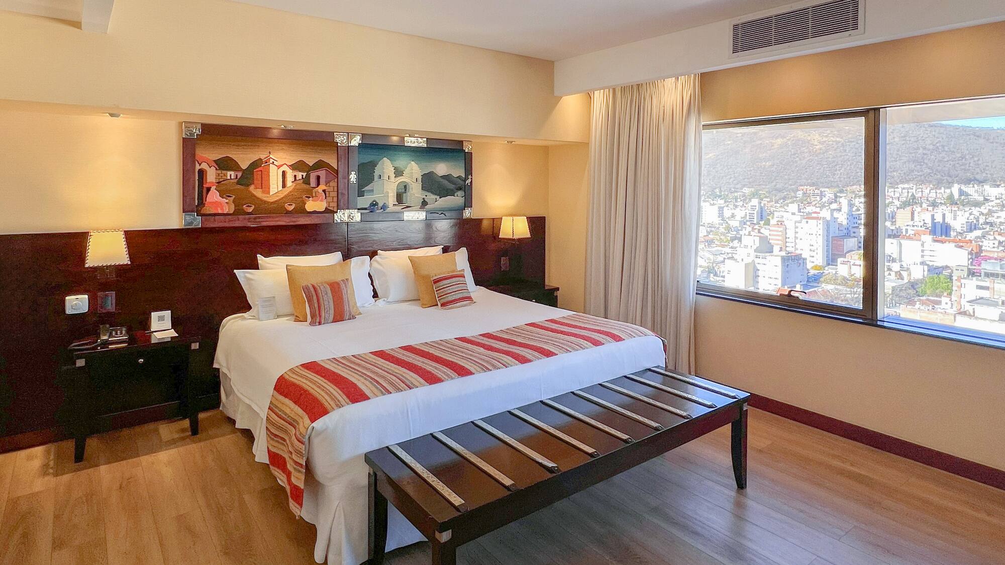 a bedroom with a bed and a table