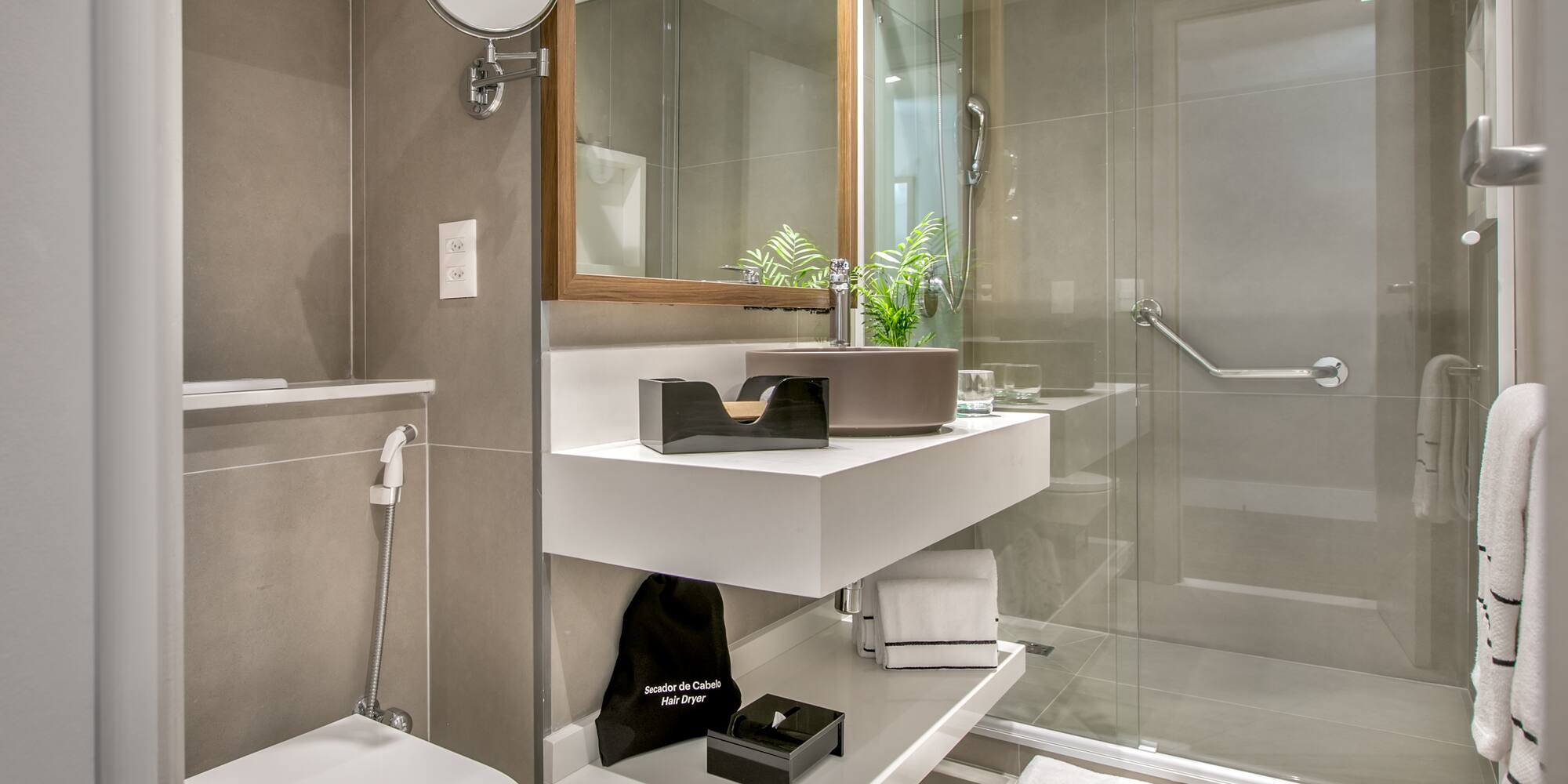 a bathroom with a glass shower door