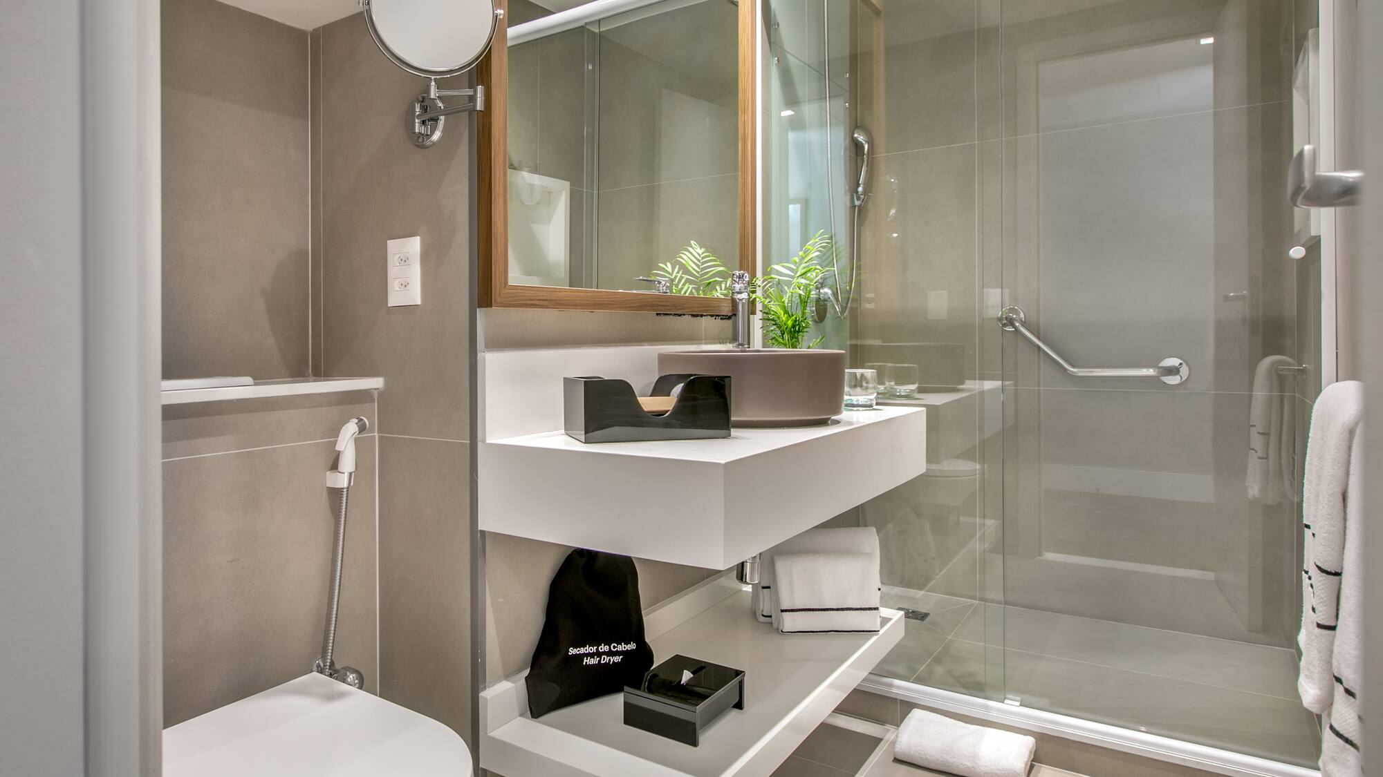 a bathroom with a glass shower door