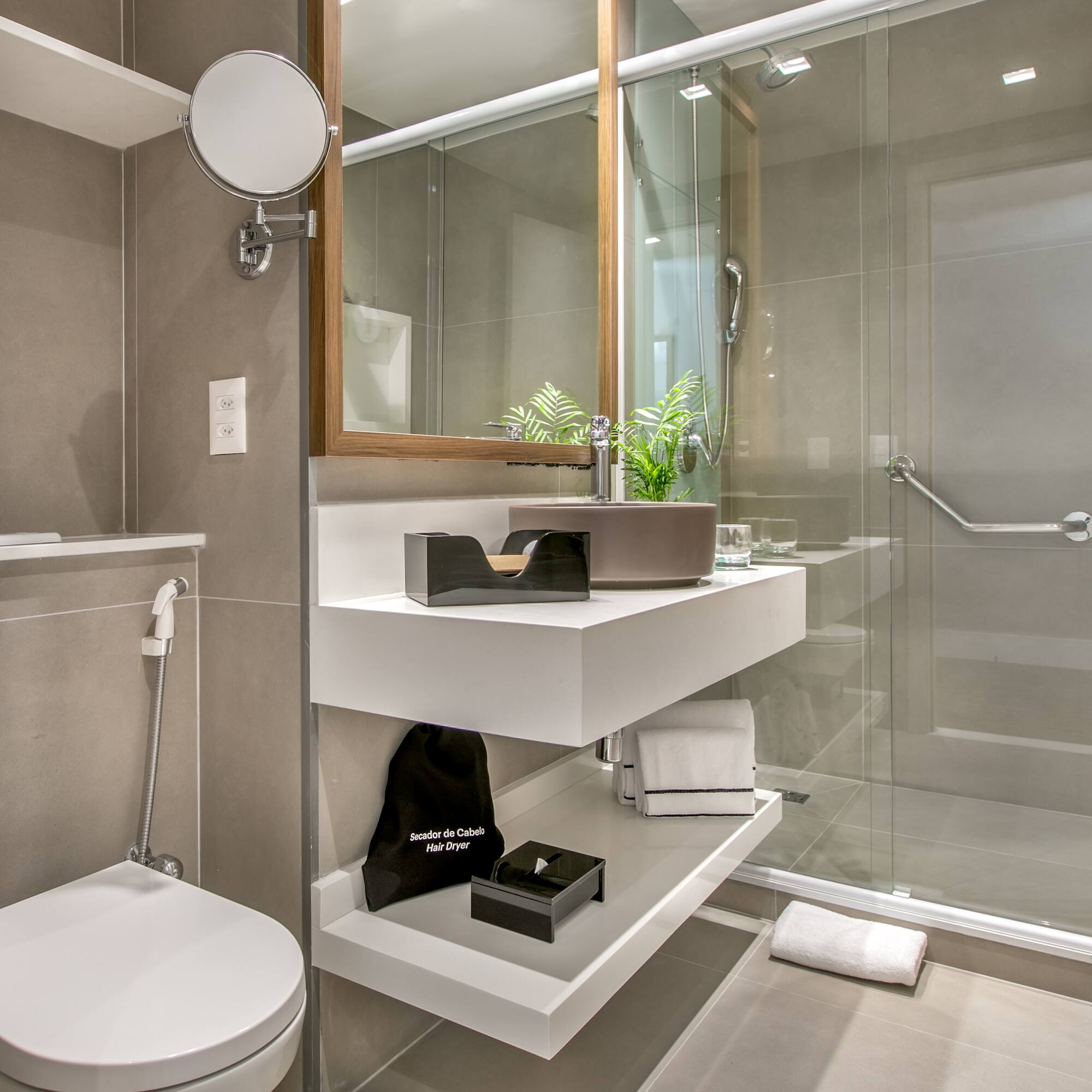 a bathroom with a glass shower door