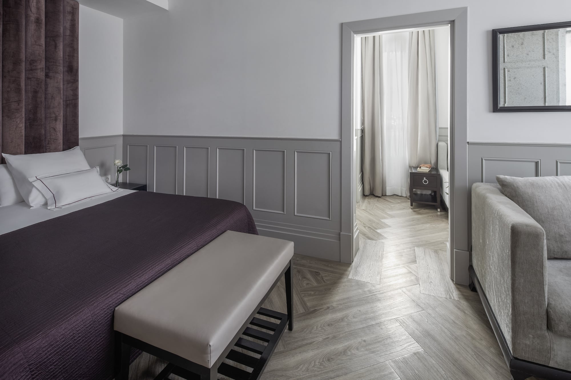 a bedroom with a bed and a bed bench