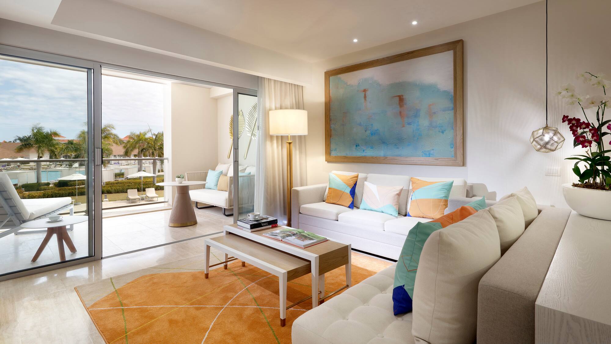 a living room with a large painting on the wall