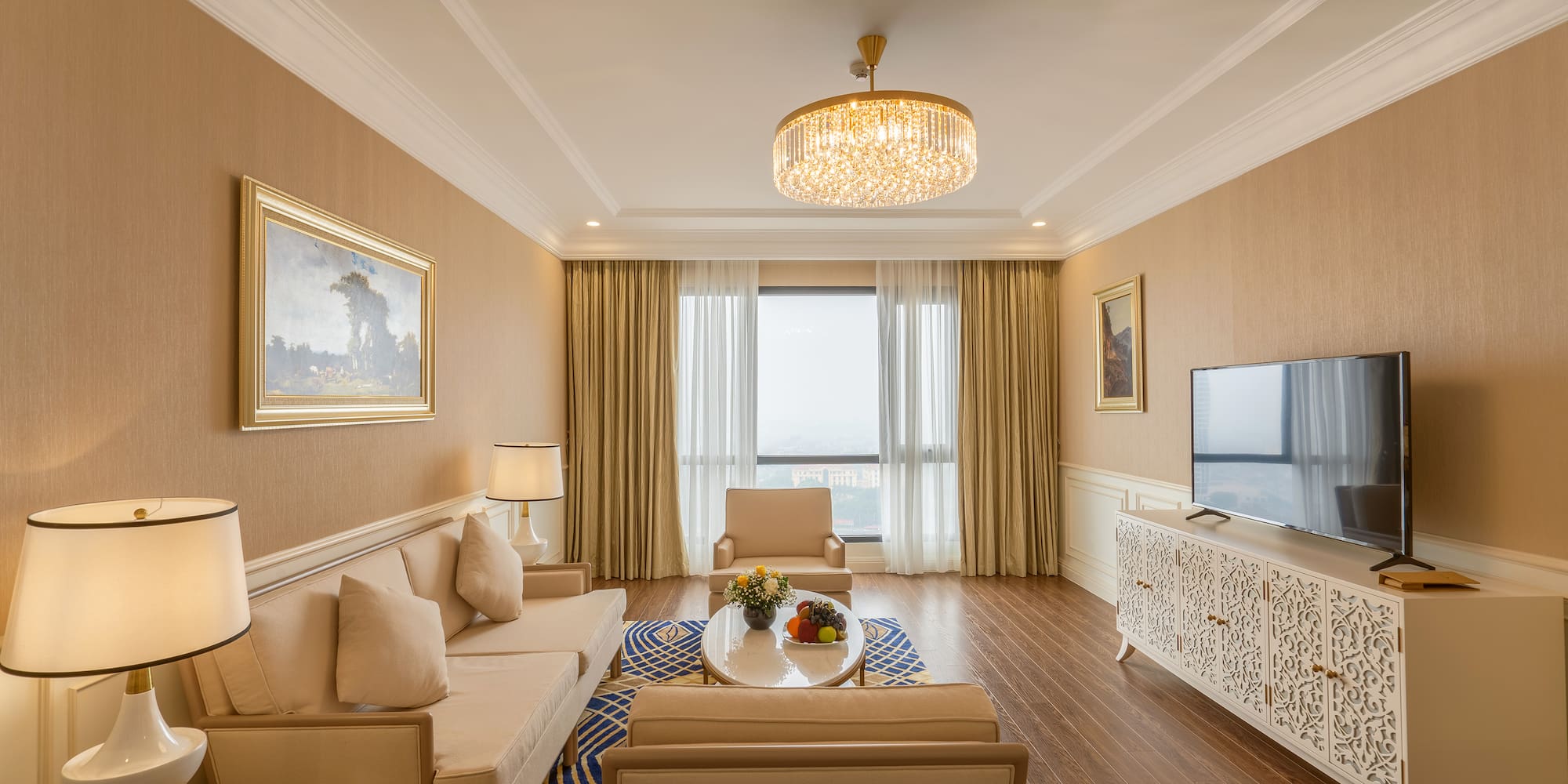 a living room with a chandelier and couches