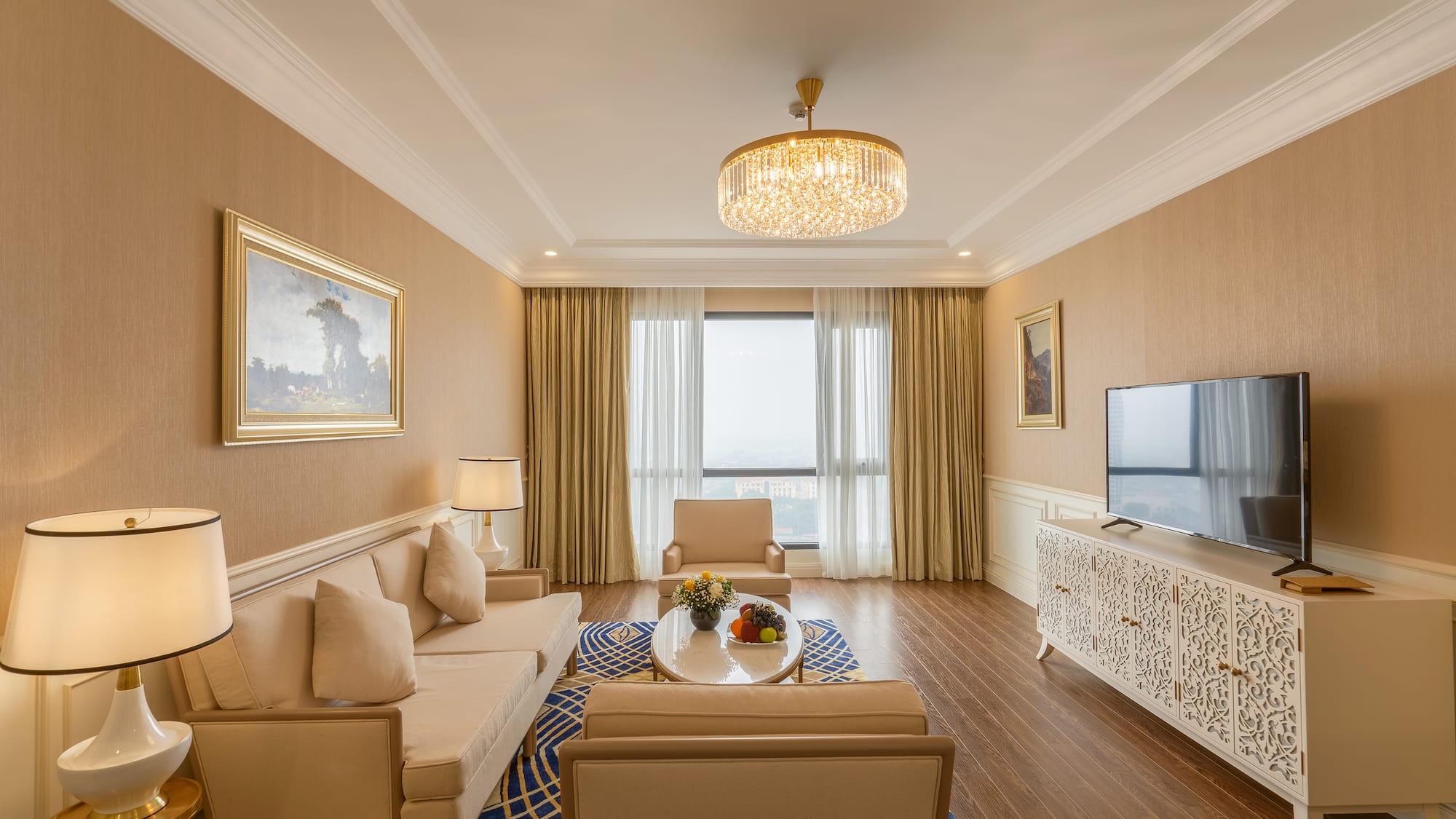 a living room with a chandelier and couches