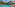 a pool with a building and trees