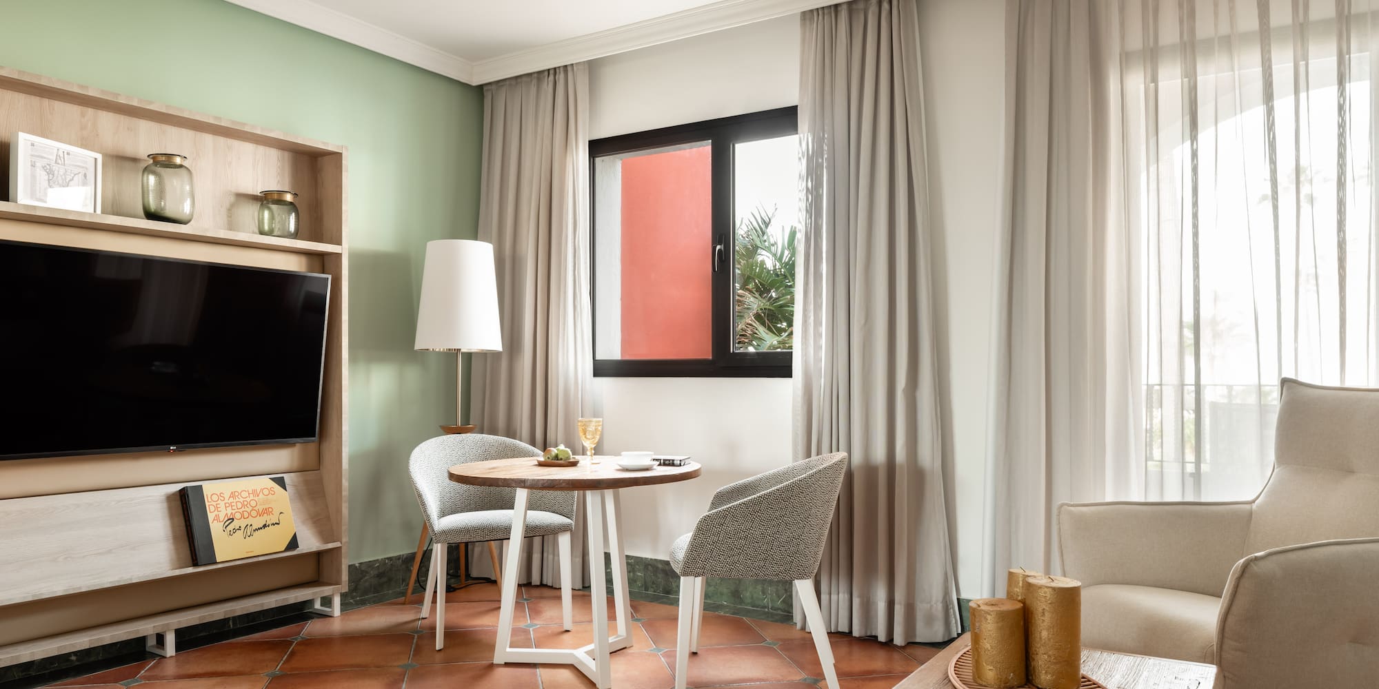 a room with a tv and table