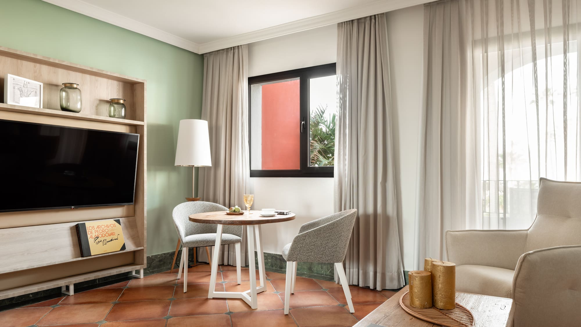 a room with a tv and table