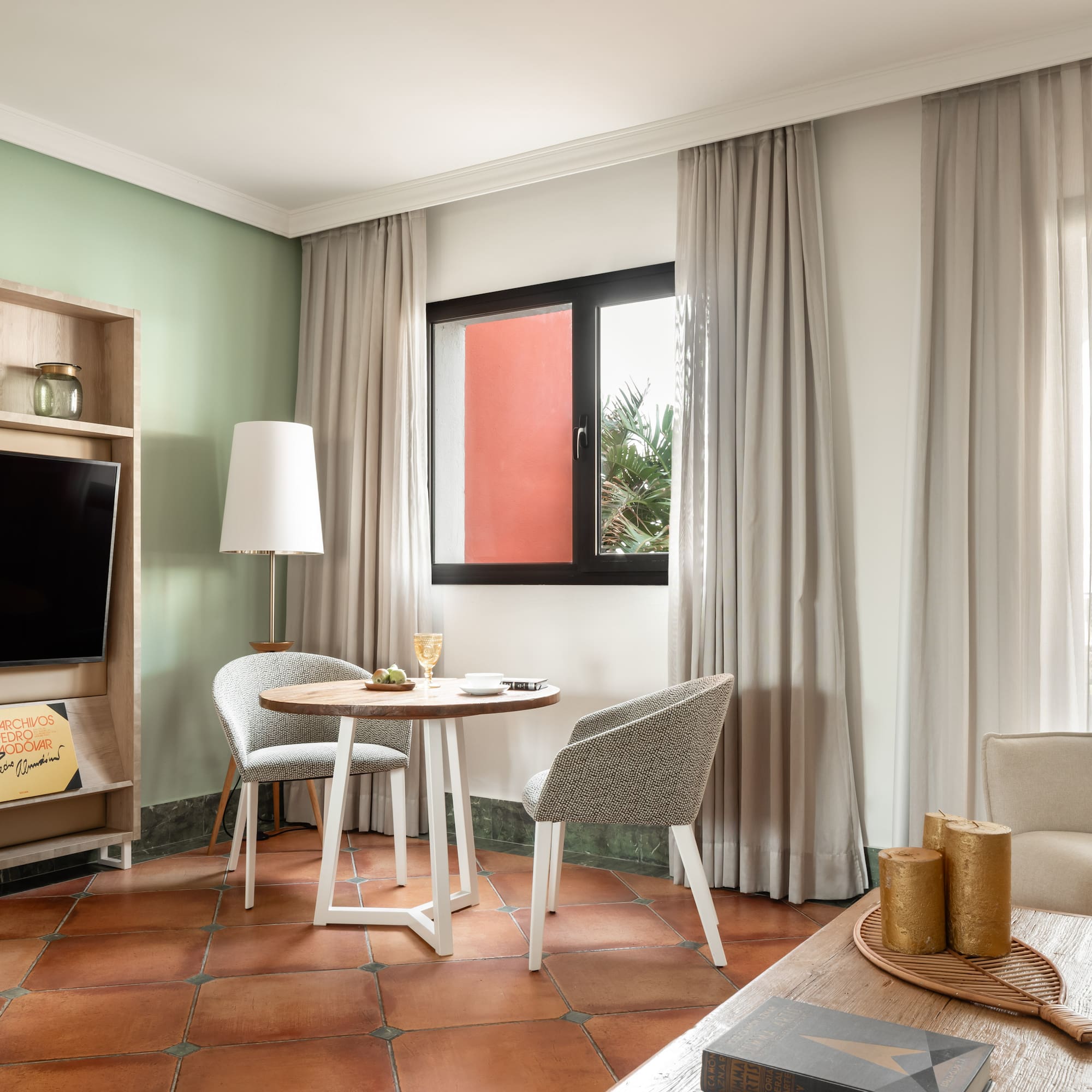 a room with a tv and table