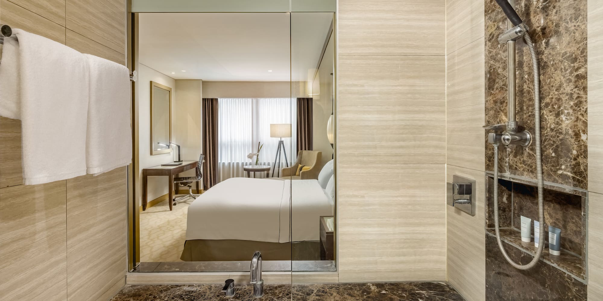 a bathroom with a mirror and a bed