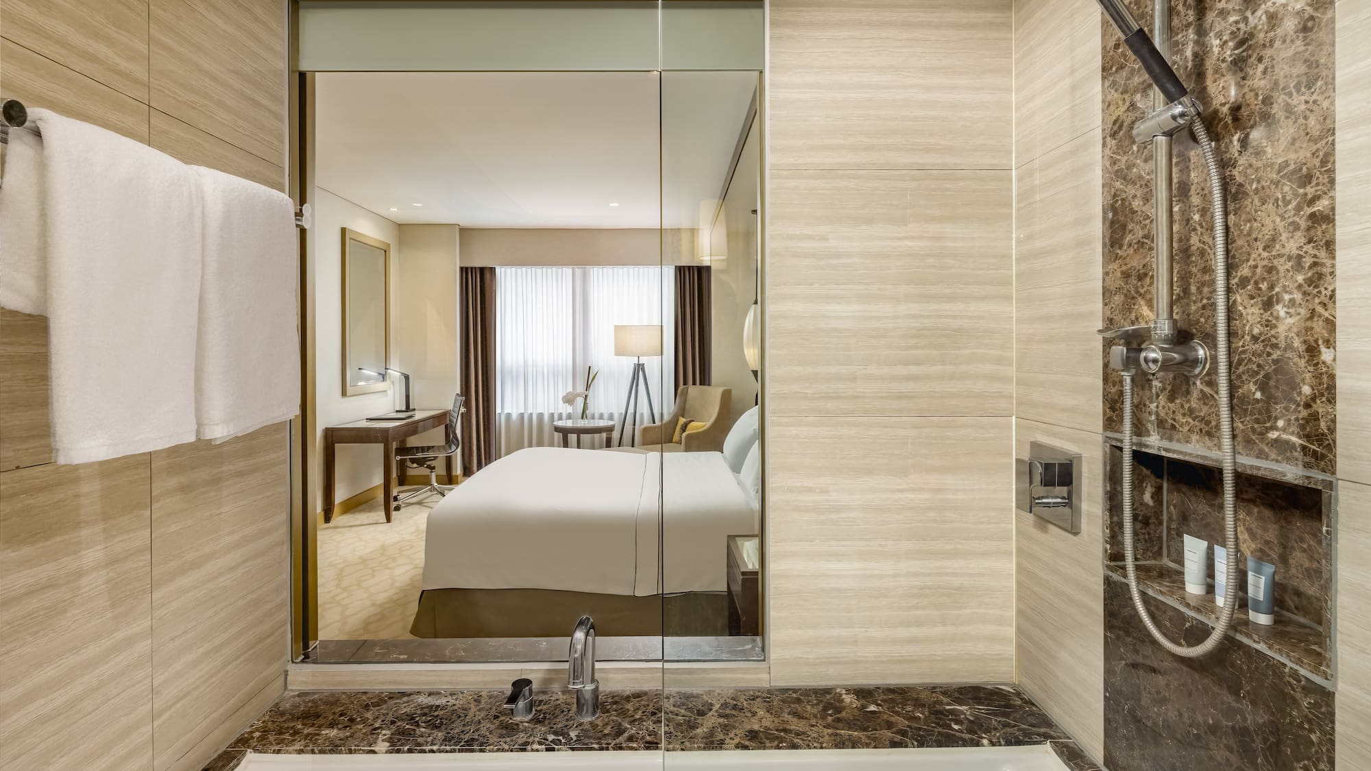 a bathroom with a mirror and a bed