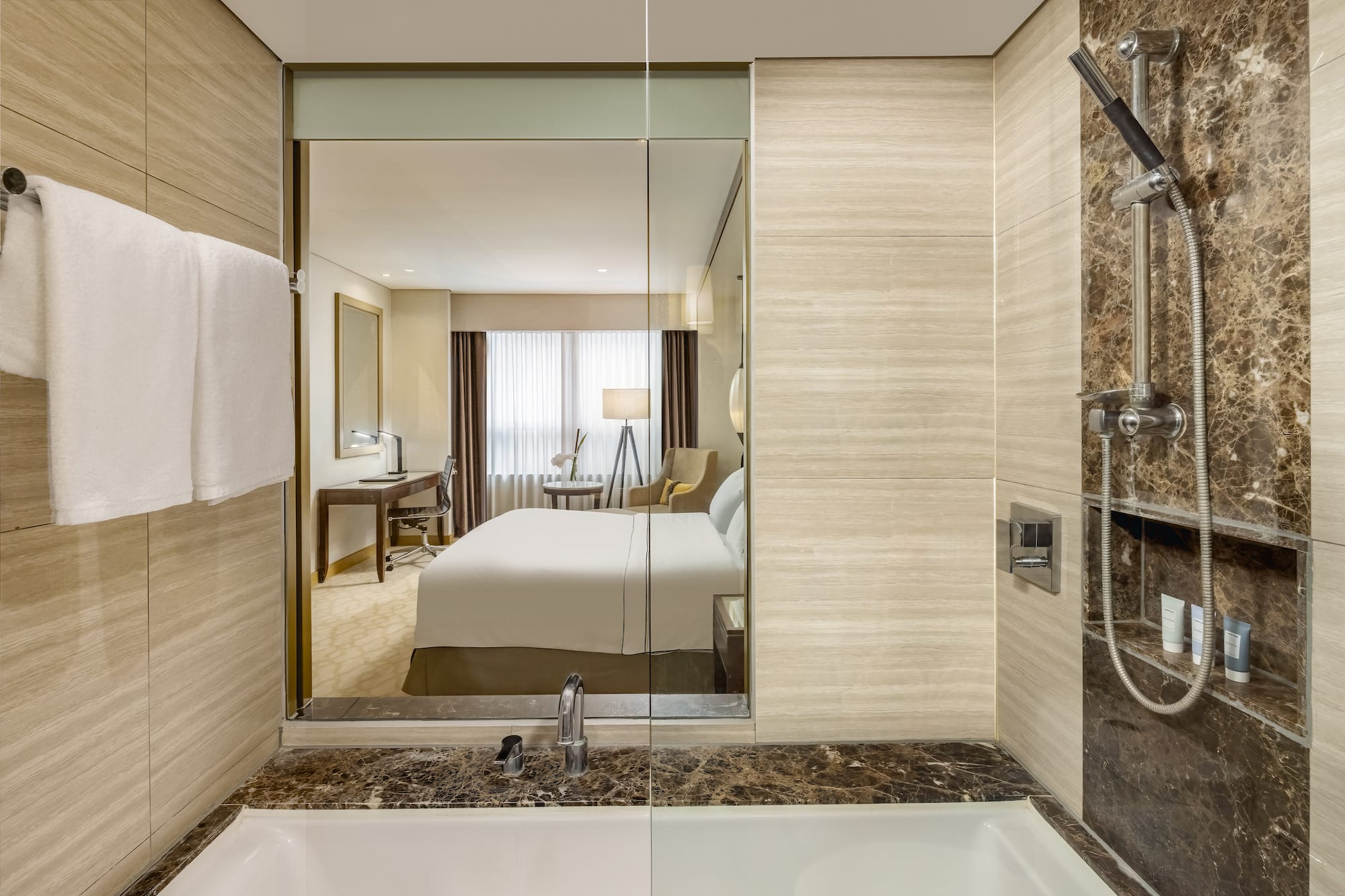 a bathroom with a mirror and a bed