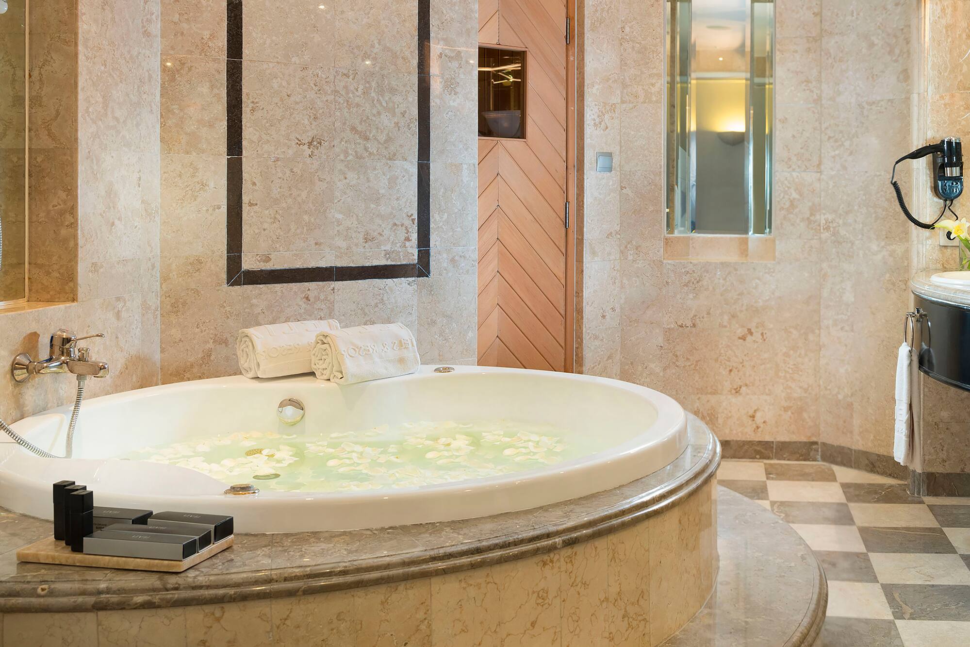 a large bathtub with flowers in it