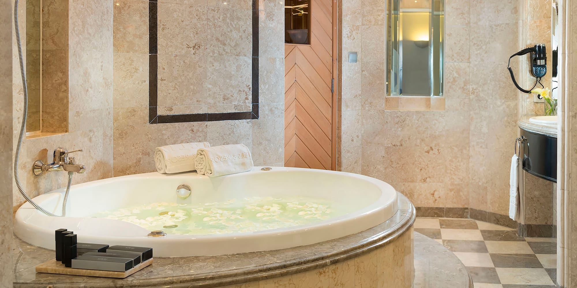 a large bathtub with flowers in it