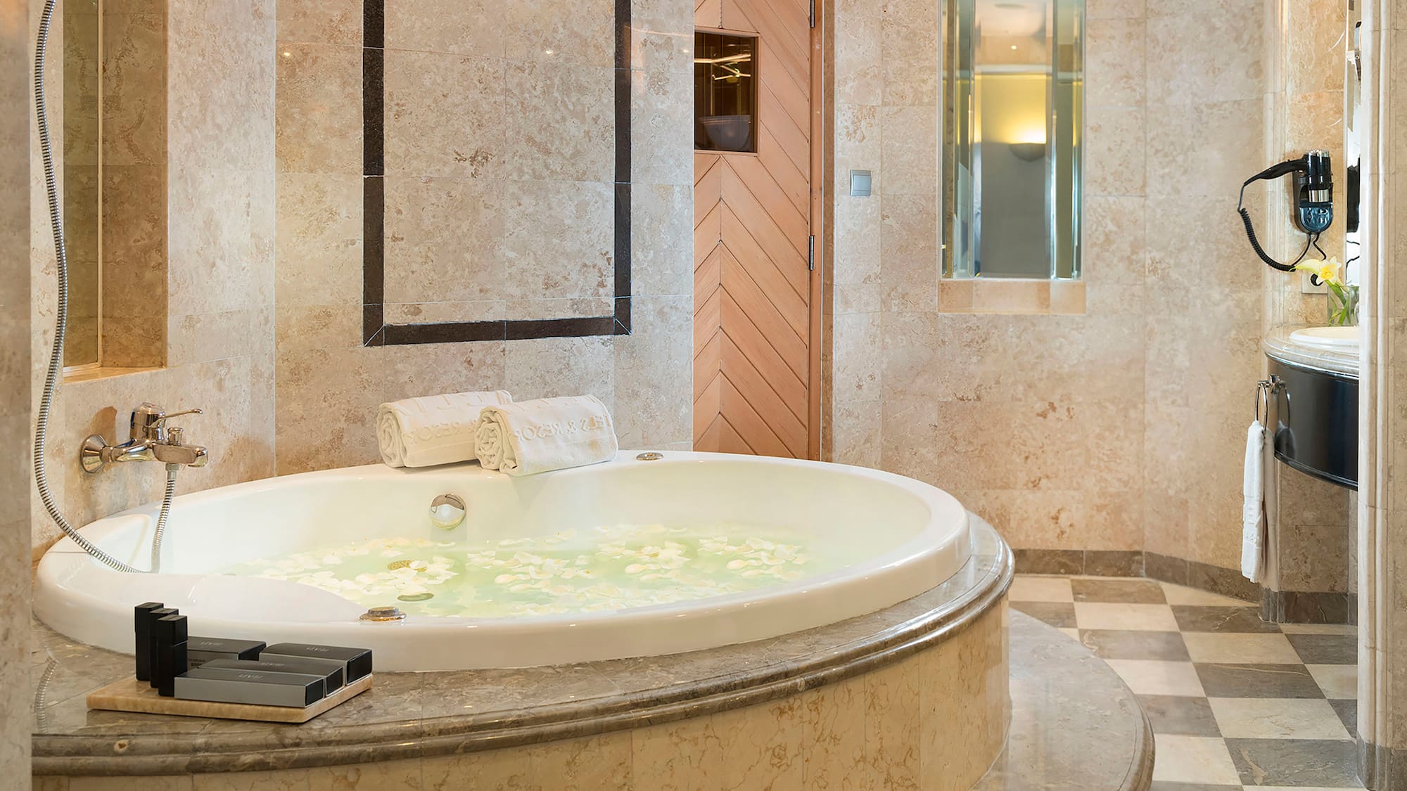 a large bathtub with flowers in it