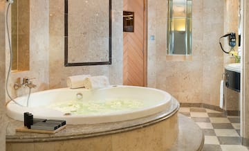 a large bathtub with flowers in it
