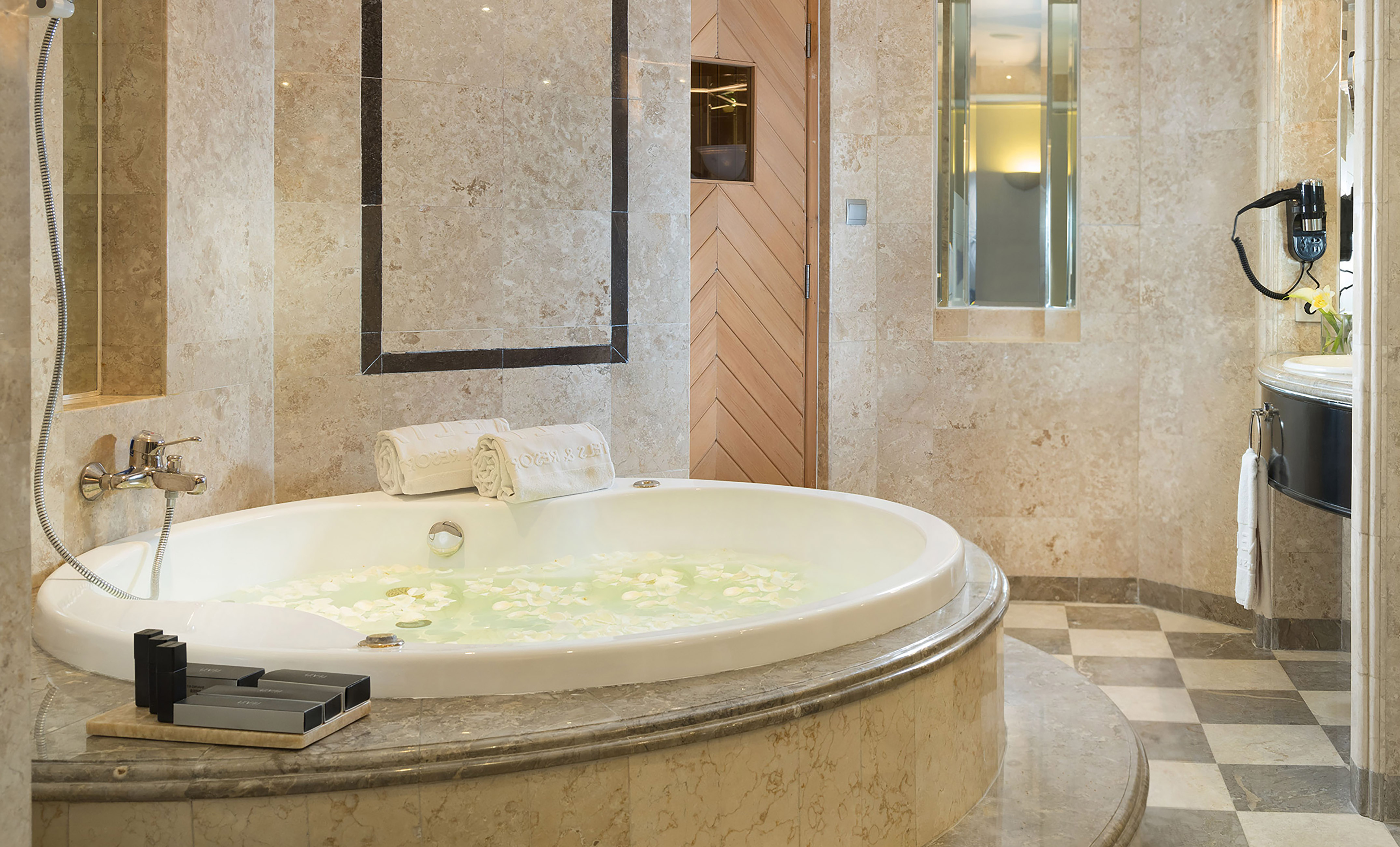 a large bathtub with flowers in it